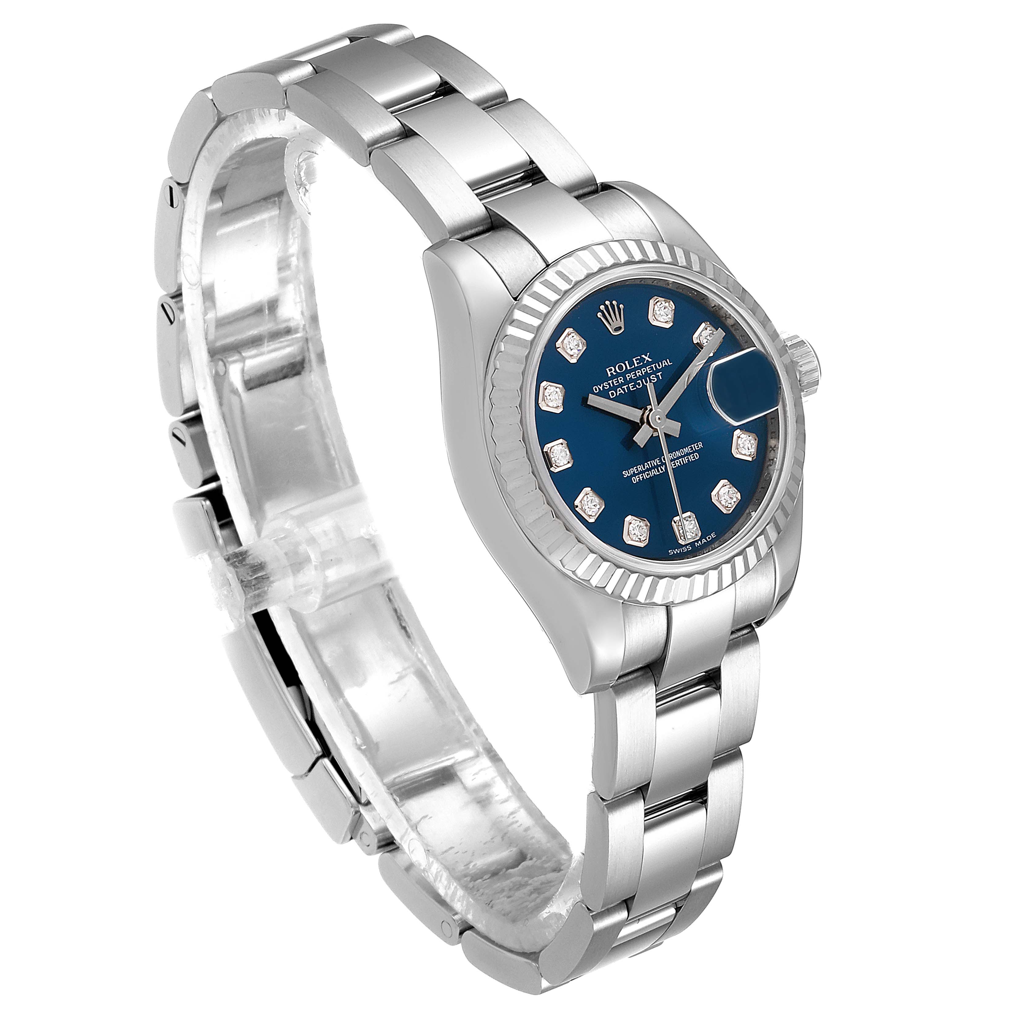 The image shows a Rolex Datejust 179174 Women's Stainless Steel Blue Dial 179174 Women's Stainless Steel Blue Dial watch from a tilted side view, highlighting the bracelet, dial, and fluted bezel.