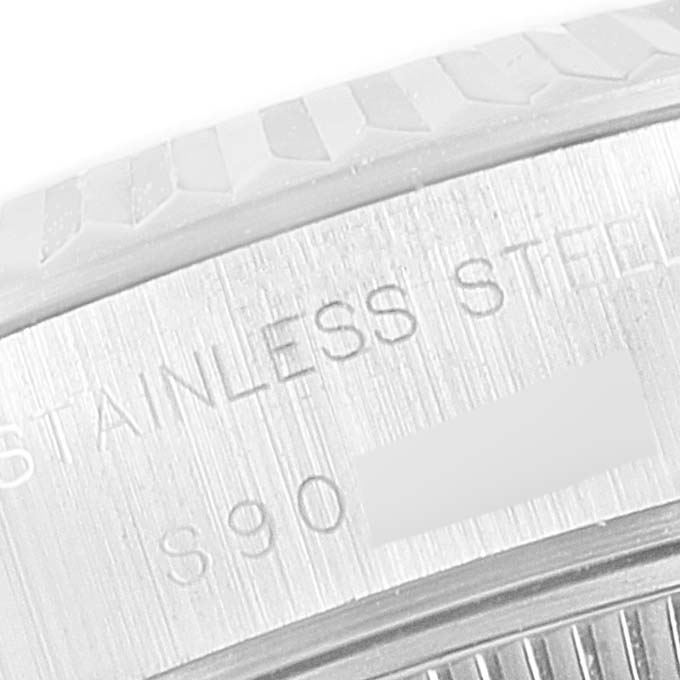 The image shows a close-up of the outer rim of a Rolex Datejust 69174 Women's Stainless Steel Silver Dial 69174 Women's Stainless Steel Silver Dial watch with engravings on the stainless steel part.