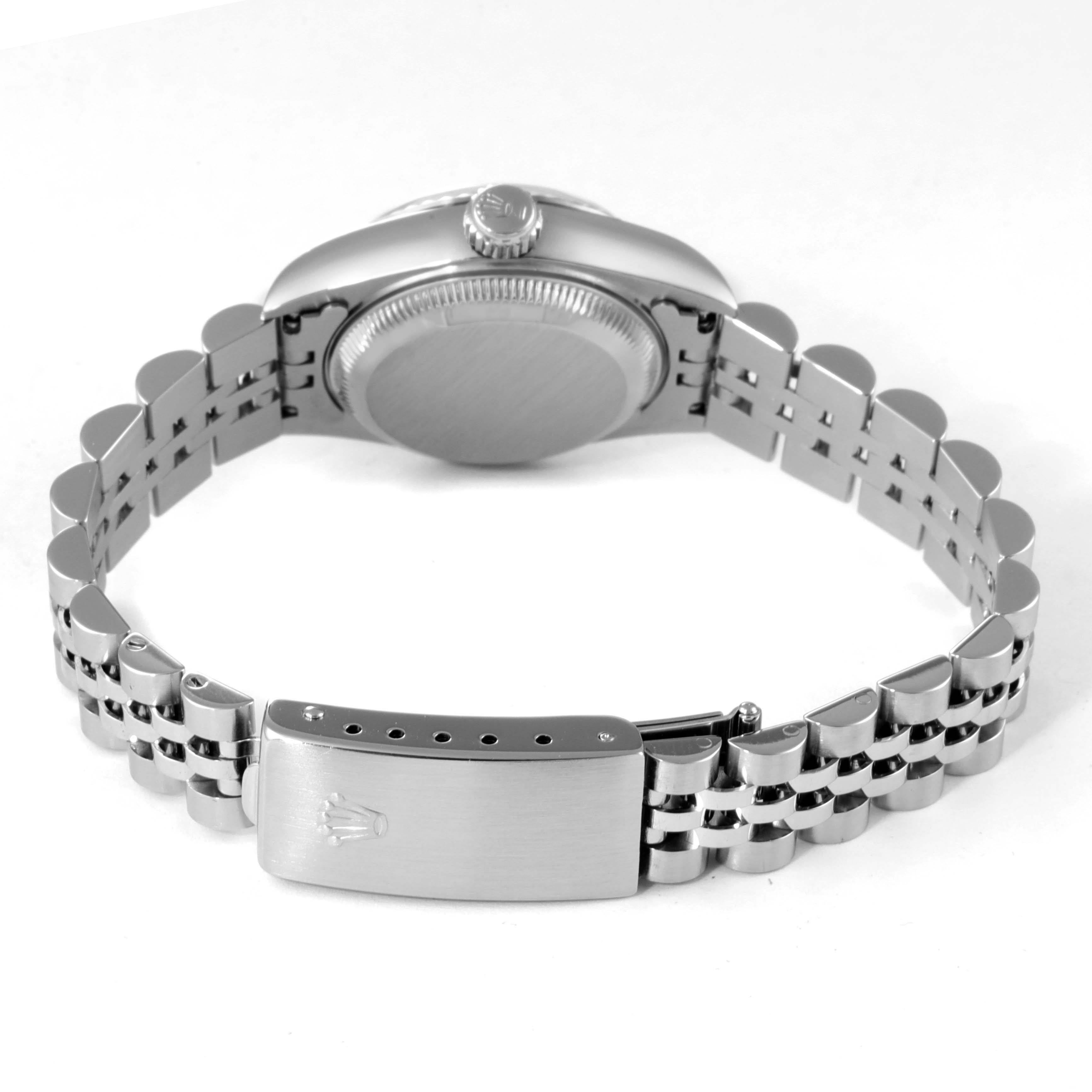 The image shows the back view of a Rolex Datejust 69174 Women's Stainless Steel Silver Dial 69174 Women's Stainless Steel Silver Dial watch, featuring its case back, crown, and bracelet clasp.