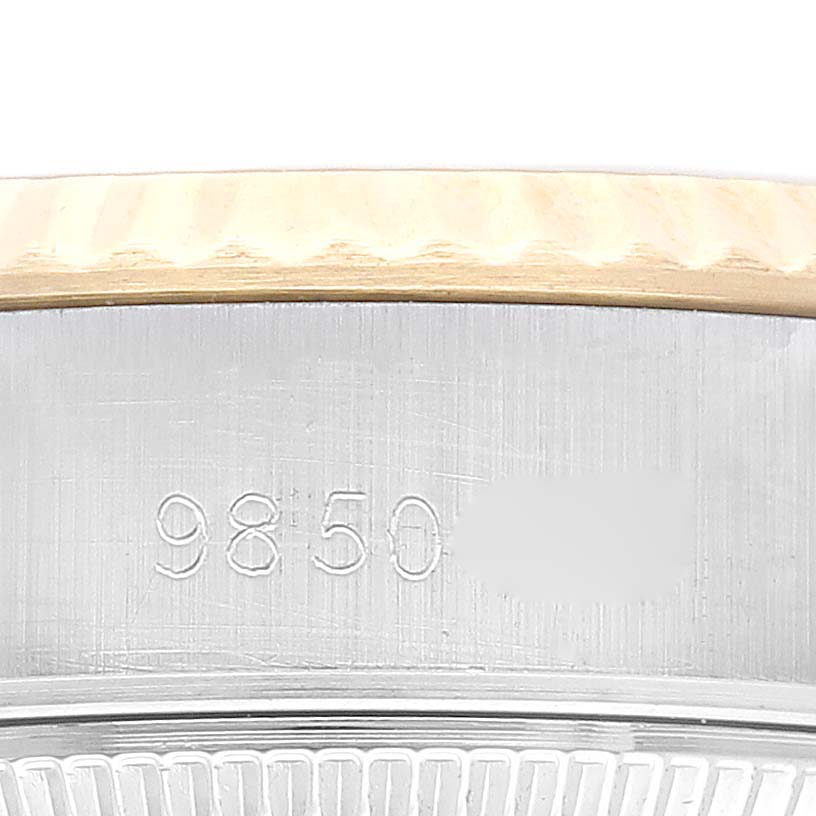 This image shows a close-up of the bezel and case with the serial number of a Rolex Datejust 69173G Women's Steel and Gold (two tone) Champagne Dial 69173G Women's Steel and Gold (two tone) Champagne Dial watch.