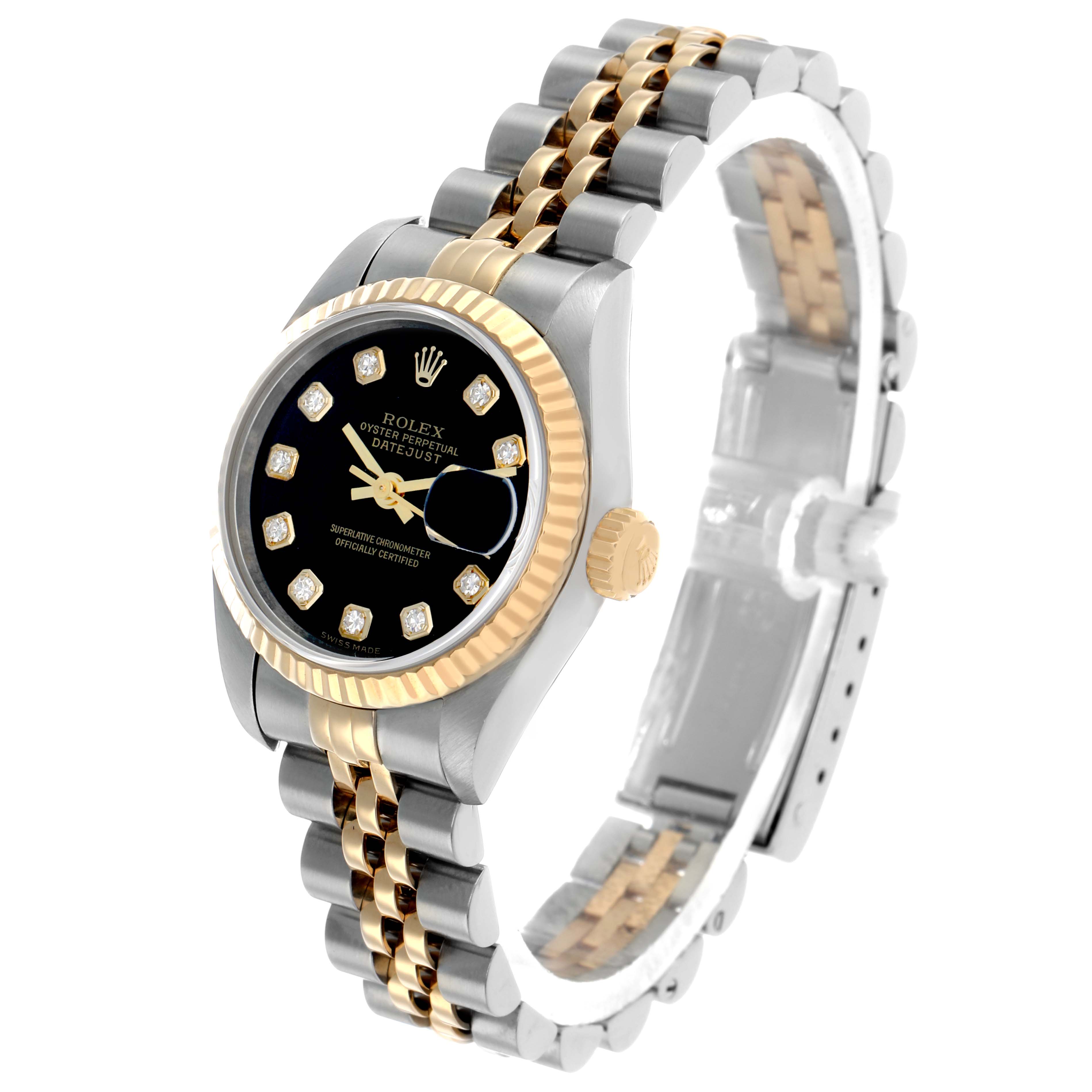 The Rolex Datejust 79173 Women's Steel and Gold (two tone) Black Dial watch is shown at a three-quarter angle, highlighting its black dial, two-tone bezel, and jubilee bracelet.