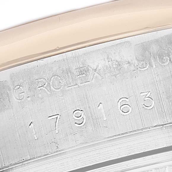 This image shows a close-up of the serial number and the case edge part of a Rolex Datejust 179163 Women's Steel and Gold (two tone) White Dial 179163 Women's Steel and Gold (two tone) White Dial watch.