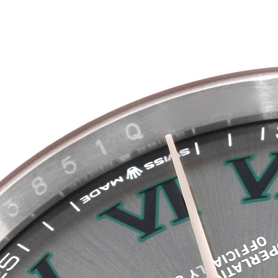 This is a close-up angle of the dial of a Rolex Datejust 126231 Men's Steel and Gold (two tone) Grey Dial 126231 Men's Steel and Gold (two tone) Grey Dial watch, showing the 'VI' Roman numeral, 'Swiss Made,' and the seconds hand.