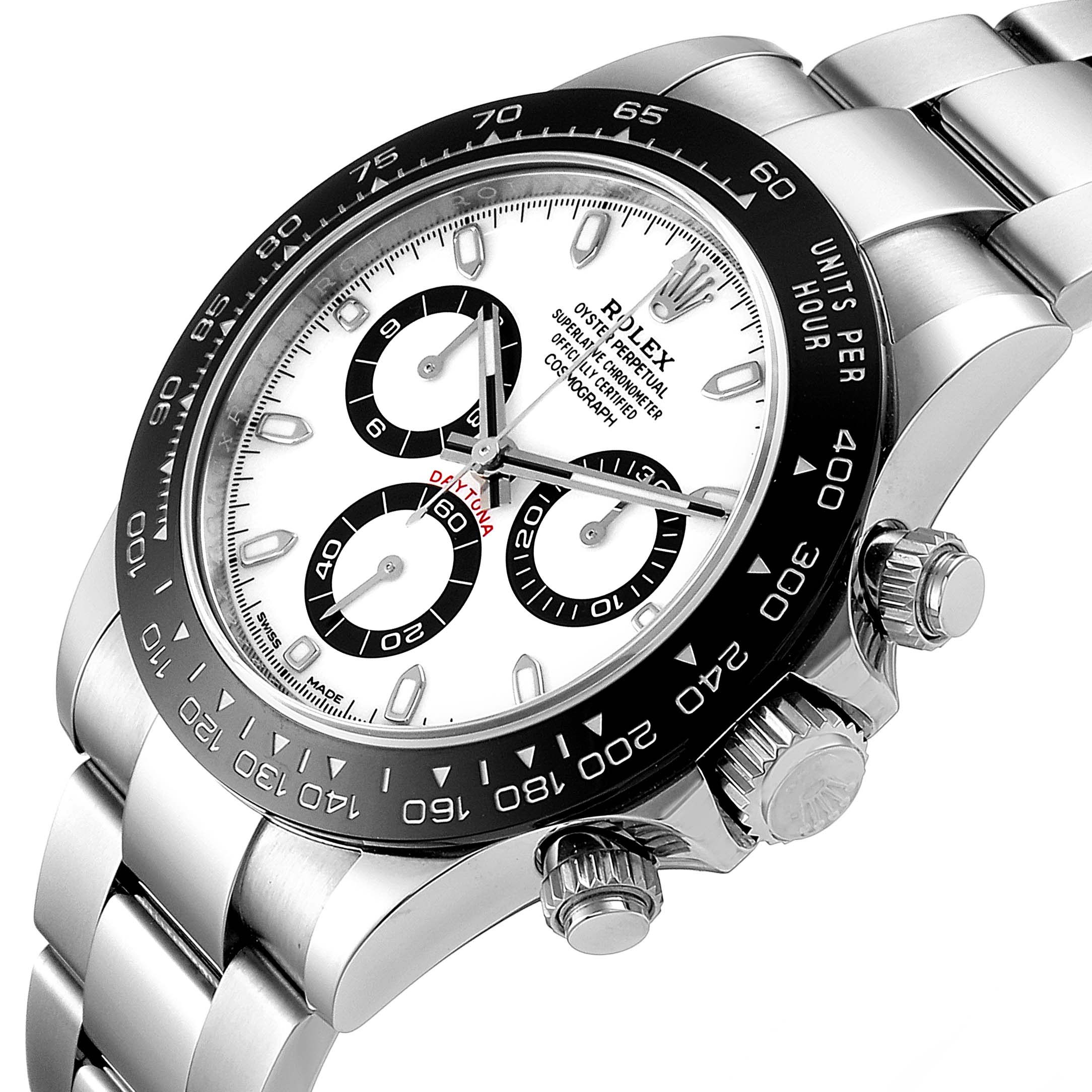 The image shows a close-up, angled view of a Rolex Daytona 116500 Men's Stainless Steel White Dial 116500 Men's Stainless Steel White Dial watch, highlighting the dial, bezel, and crown.