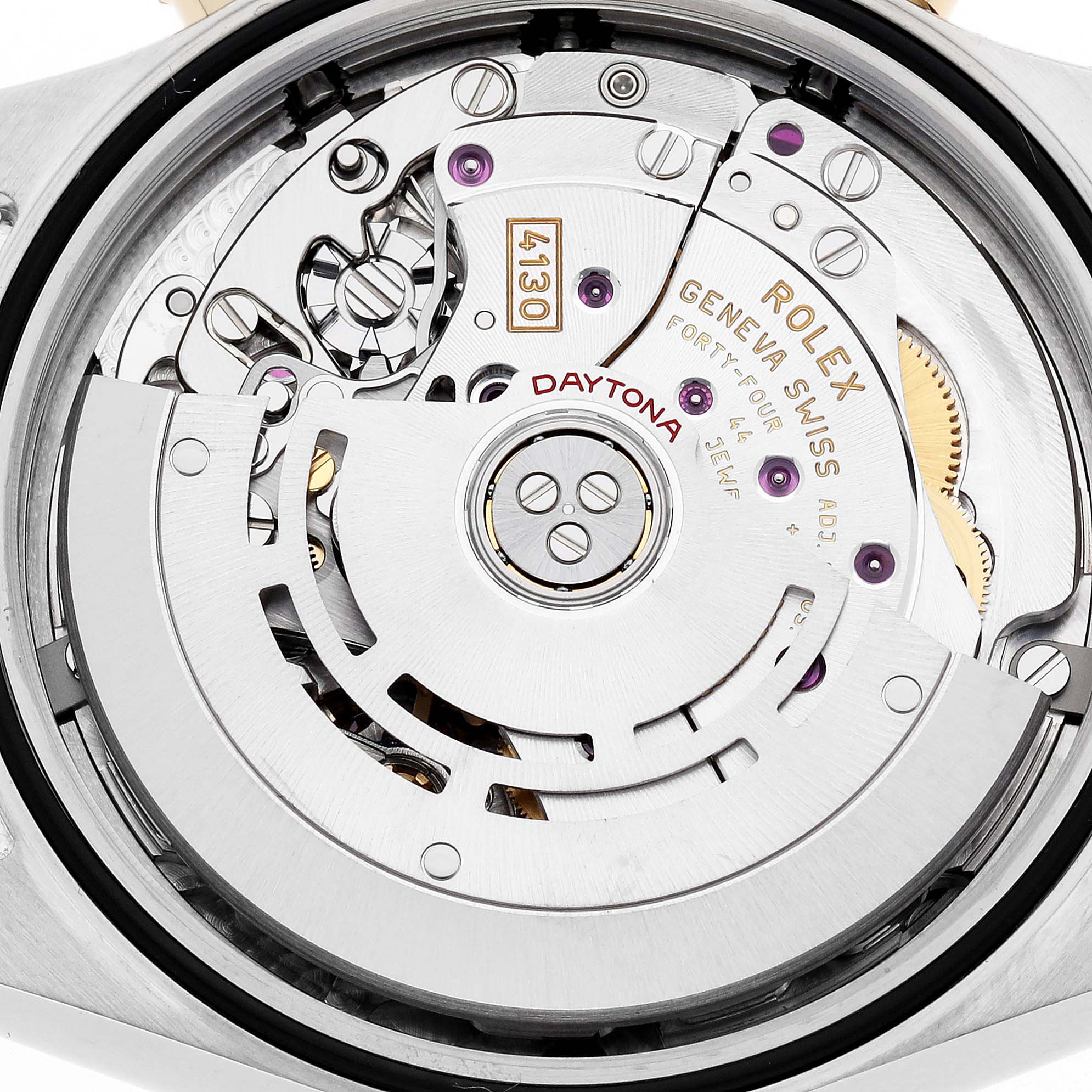 The image shows a close-up view of the Rolex Daytona 116503 Men's Steel and Gold (two tone) Mother of Pearl Dial's movement, highlighting gears, rotors, and inscriptions.