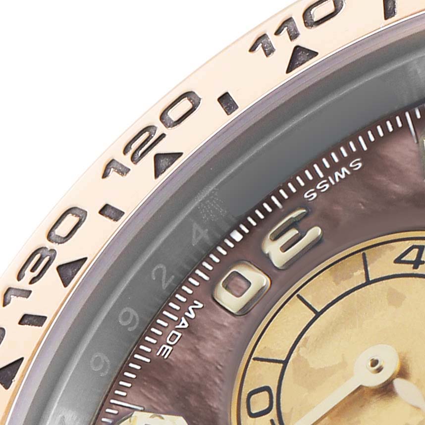 The image shows a close-up of the bezel and part of the dial of a Rolex Daytona 116503 Men's Steel and Gold (two tone) Mother of Pearl Dial watch, focusing on the numbers and markers.