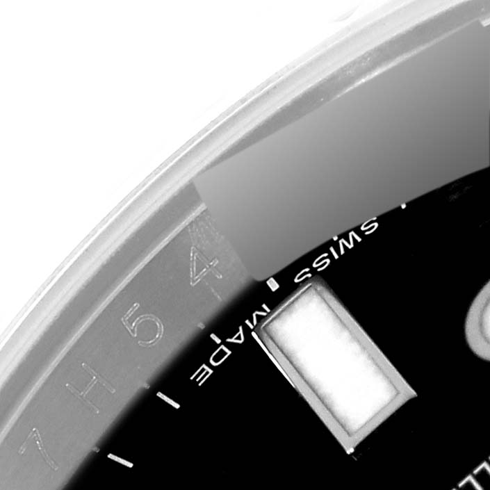 This image shows a close-up of the dial and bezel of the Rolex Explorer 216570 Men
s Stainless Steel Black Dial 216570 Men
s Stainless Steel Black Dial watch, including the "Swiss Made" text.