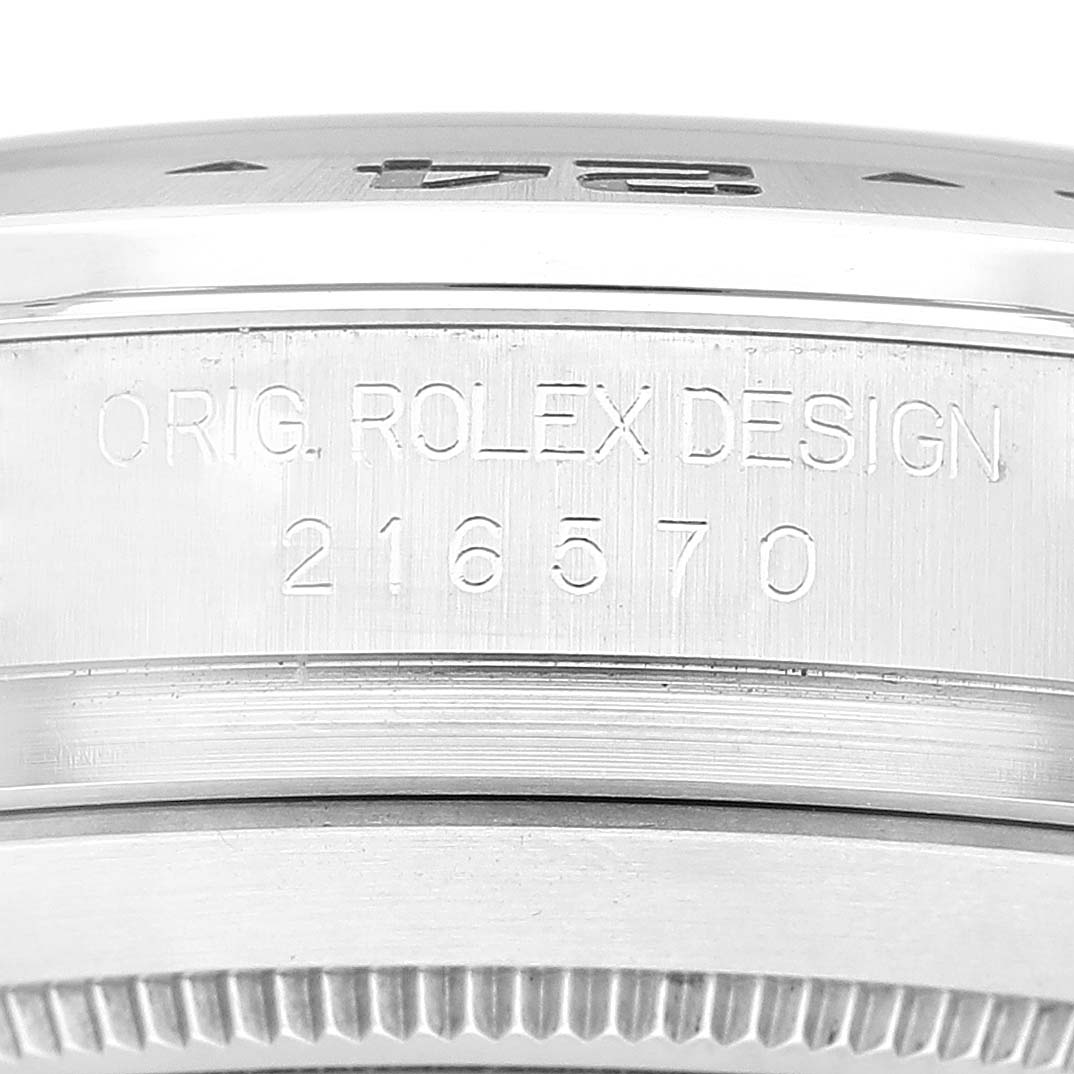 This close-up shows the side engraving and outer edge of the bezel of a Rolex Explorer 216570 Men's Stainless Steel White Dial 216570 Men's Stainless Steel White Dial model.