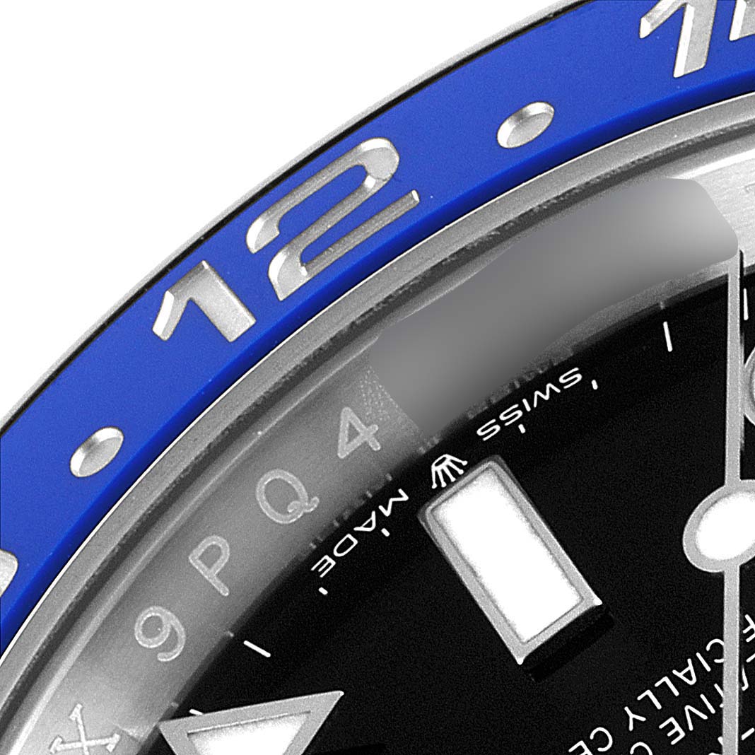This close-up angle of the Rolex GMT-Master 126710 Men's Stainless Steel Black Dial 126710 Men's Stainless Steel Black Dial watch shows part of the blue bezel, dial, and a triangular hour marker.