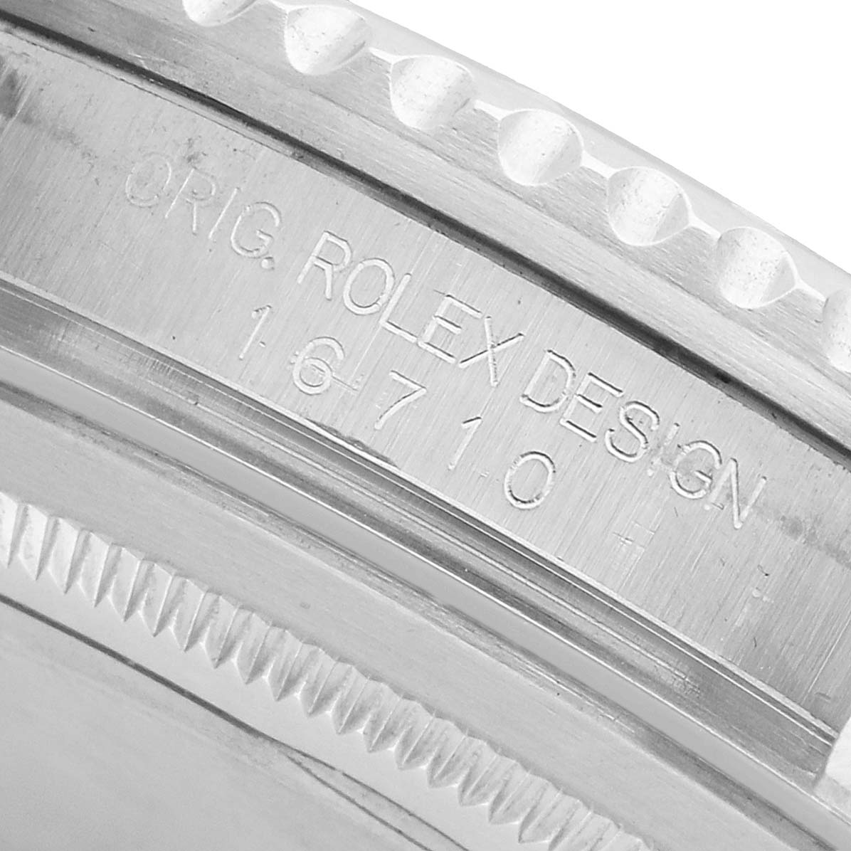 The image shows a close-up of the Rolex GMT-Master 16710 Men's Stainless Steel Black Dial model 16710 with engraved text on the watch's side.