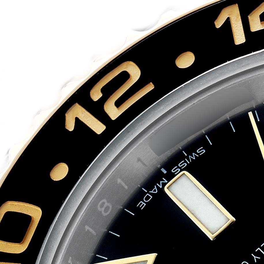 The image shows a close-up of the Rolex GMT-Master 116713 Men's Steel and Gold (two tone) Black Dial bezel and partial dial, highlighting the numbers and hour markers.