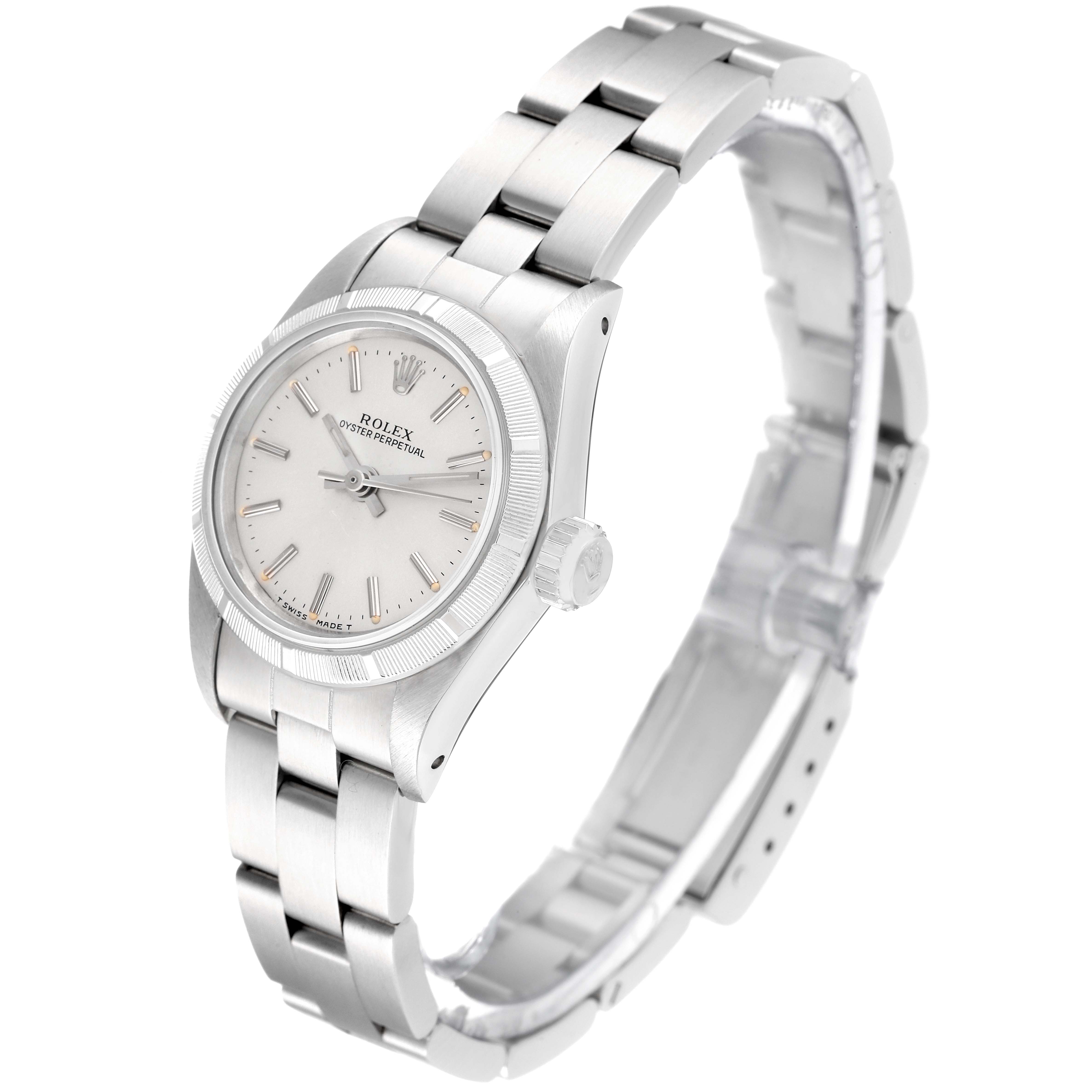 The Rolex Oyster Perpetual 67230 Women's Stainless Steel Silver Dial 67230 Women's Stainless Steel Silver Dial watch is shown at an angled side view, displaying the bracelet, case, bezel, dial, and crown.