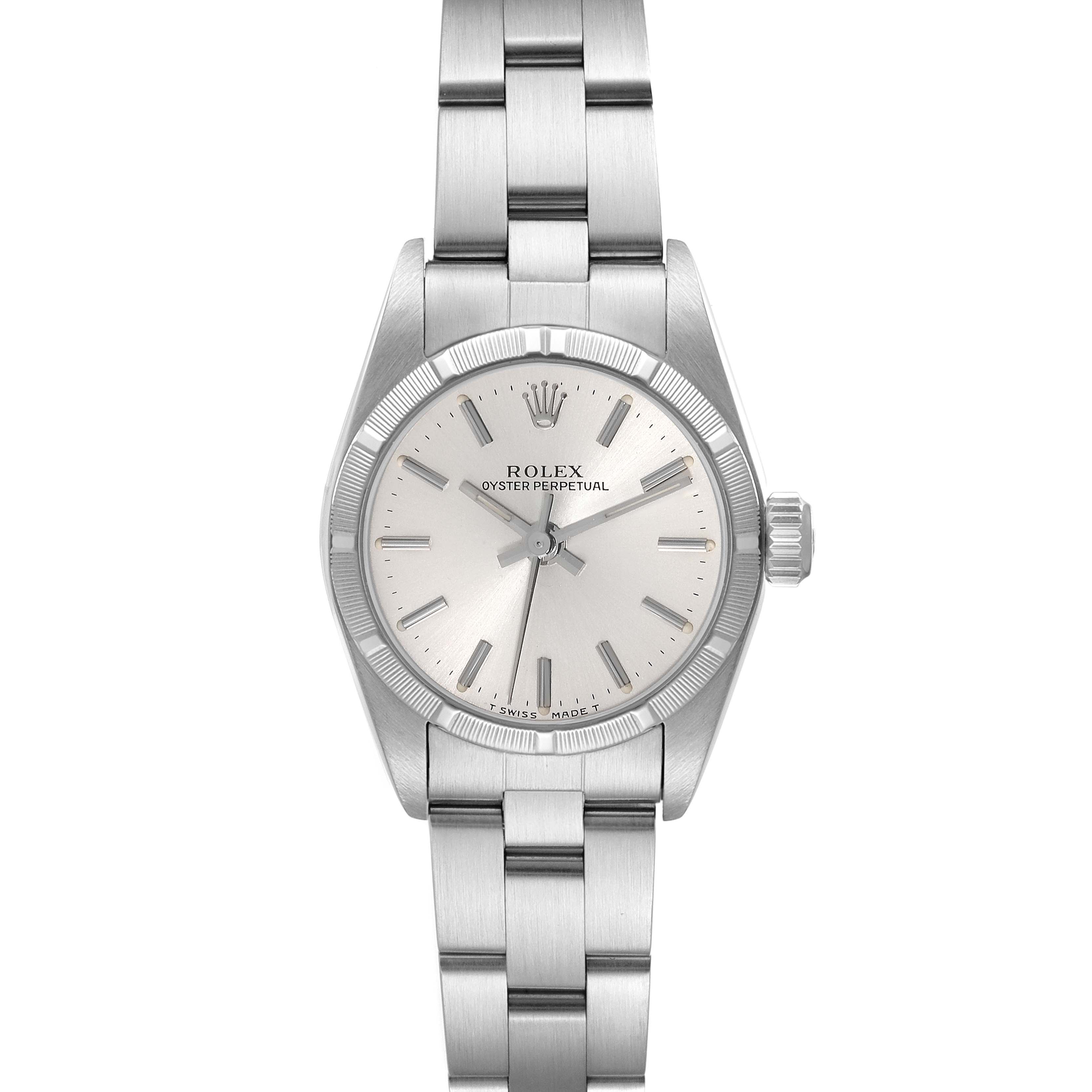The image shows a front view of the Rolex Oyster Perpetual 67230 Women's Stainless Steel Silver Dial 67230 Women's Stainless Steel Silver Dial watch, including the dial, hands, crown, and part of the metal bracelet.