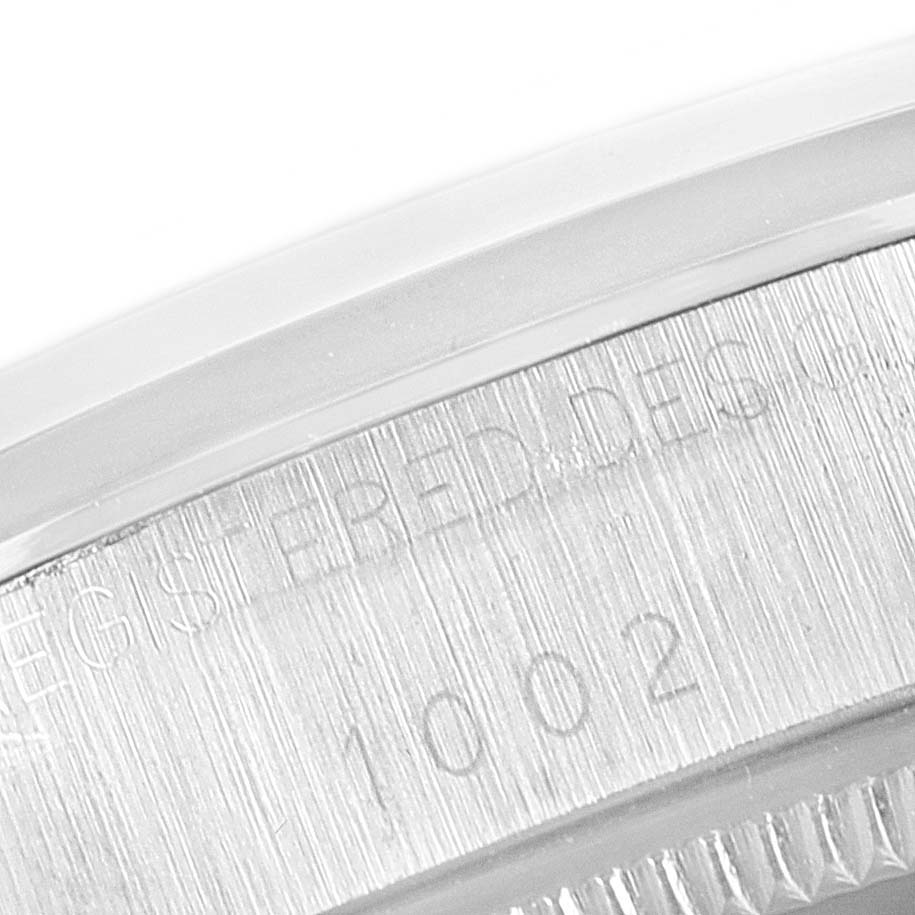This close-up image shows the engraved bezel edge of the Rolex Vintage Collection 1002 Men's Stainless Steel Silver Dial 1002 Men's Stainless Steel Silver Dial model.