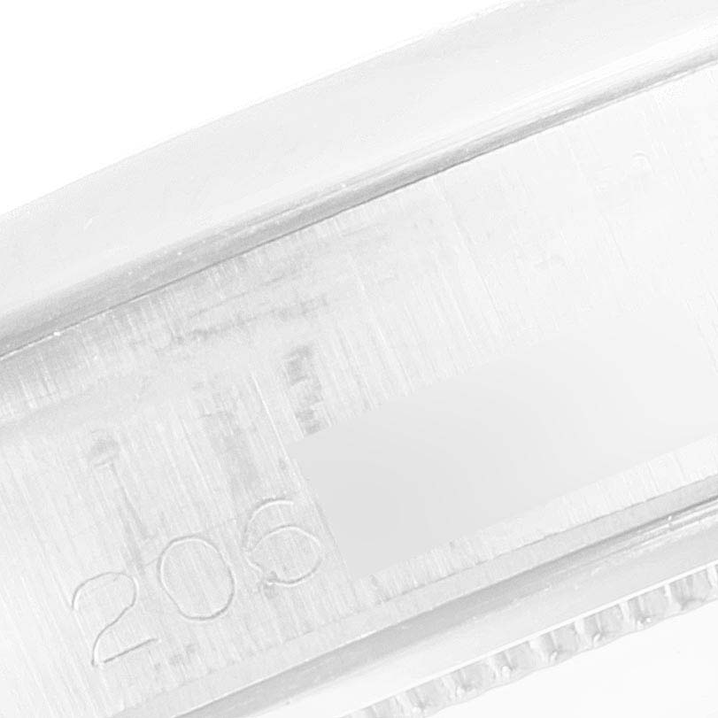 This close-up image shows the serial number engraved on the metal case of the Rolex Vintage Collection 6694 Men's Stainless Steel Blue Dial 6694 Men's Stainless Steel Blue Dial watch.