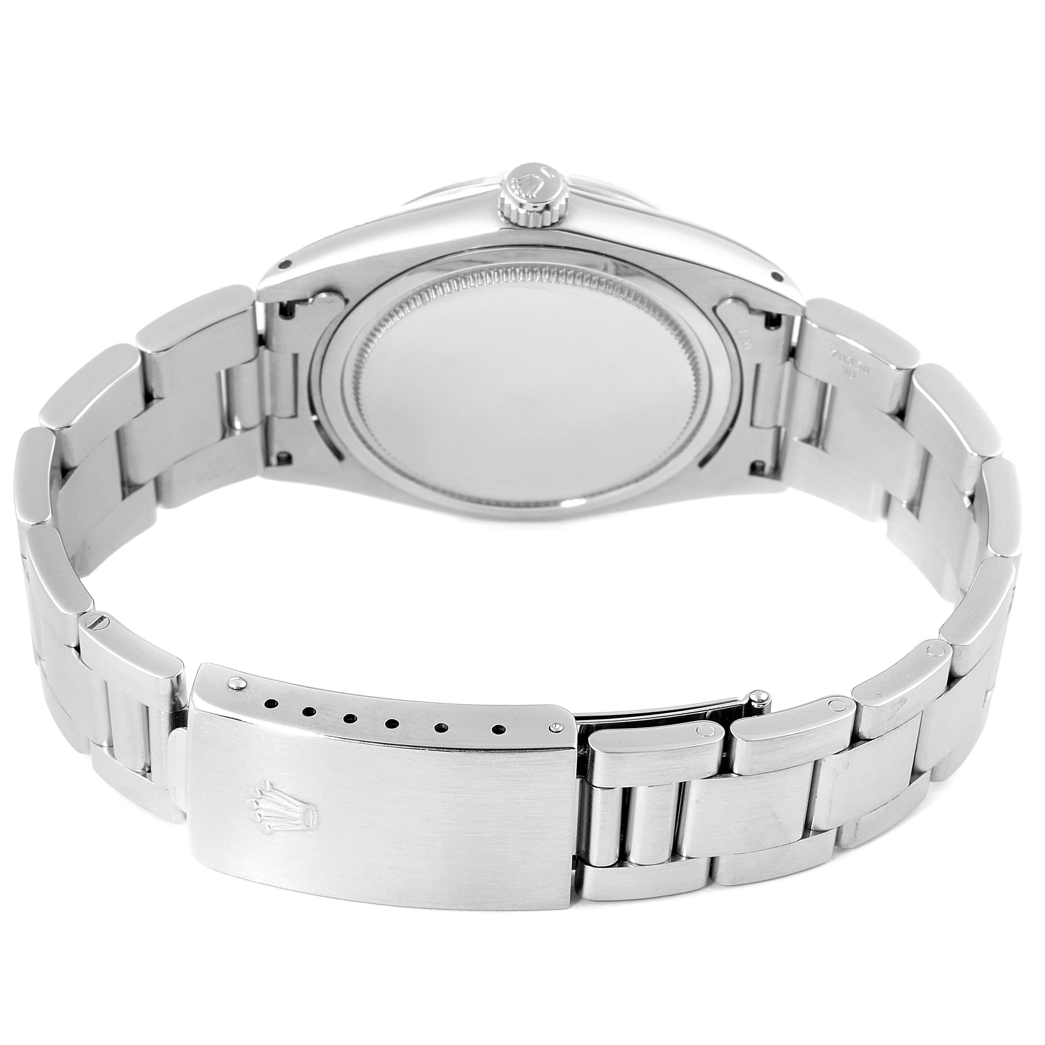 The image shows the back case and bracelet clasp of the Vintage Collection model by Rolex.