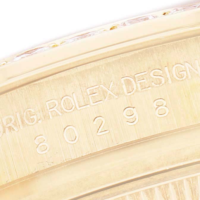The image shows a close-up of the Rolex Pearlmaster 80298 Women's Yellow Gold White Dial's engraved case, highlighting the model number and design details.