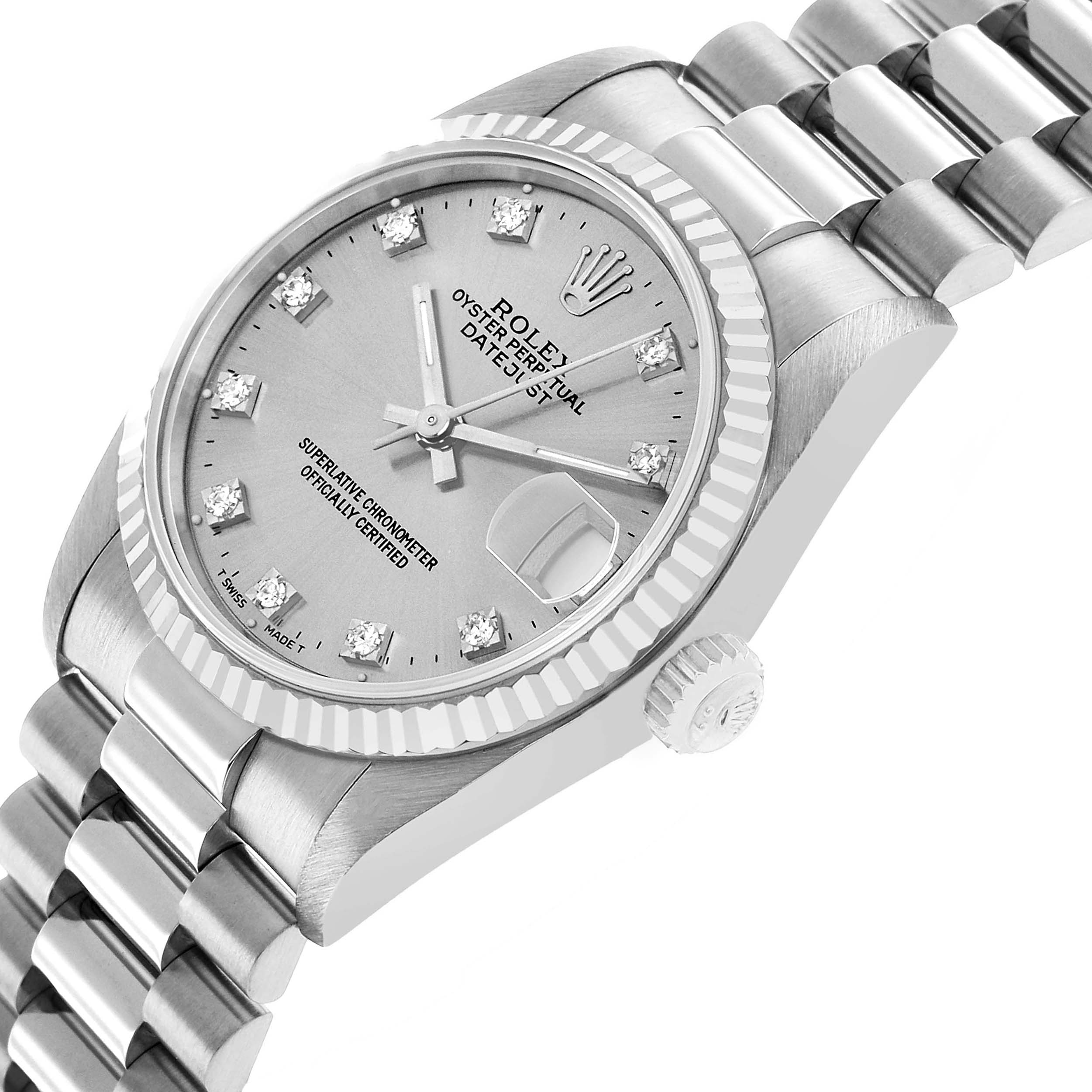 The Rolex President 68279 Women's White Gold Silver Dial watch is shown from a side angle, highlighting the case, dial, fluted bezel, and part of the bracelet.