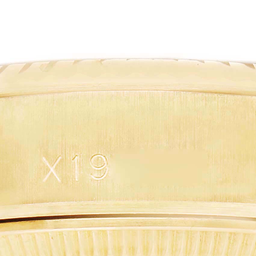 The image shows the side view of a Rolex President 69178 Women's Yellow Gold Black Dial model, focusing on the watch case with markings.