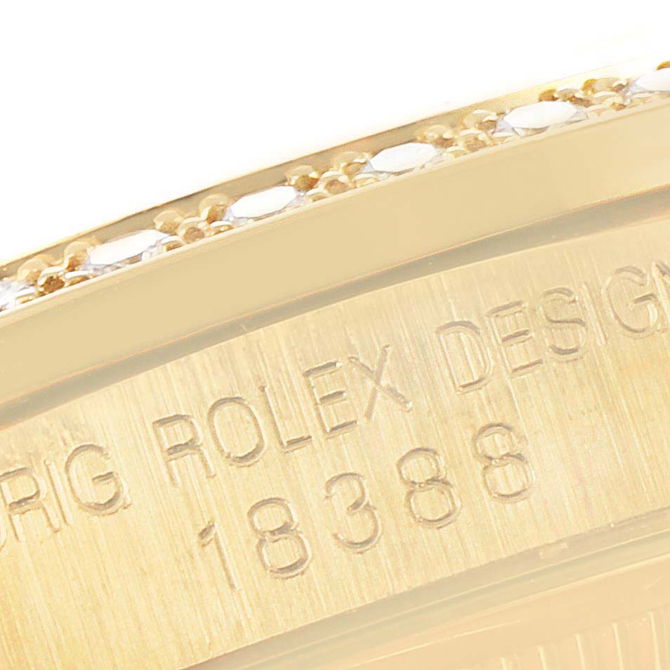 This close-up image of a Rolex President 18238 Men's Yellow Gold Silver Dial 18238 Men's Yellow Gold Silver Dial model shows the case back with the inscribed model number and part of the bezel.