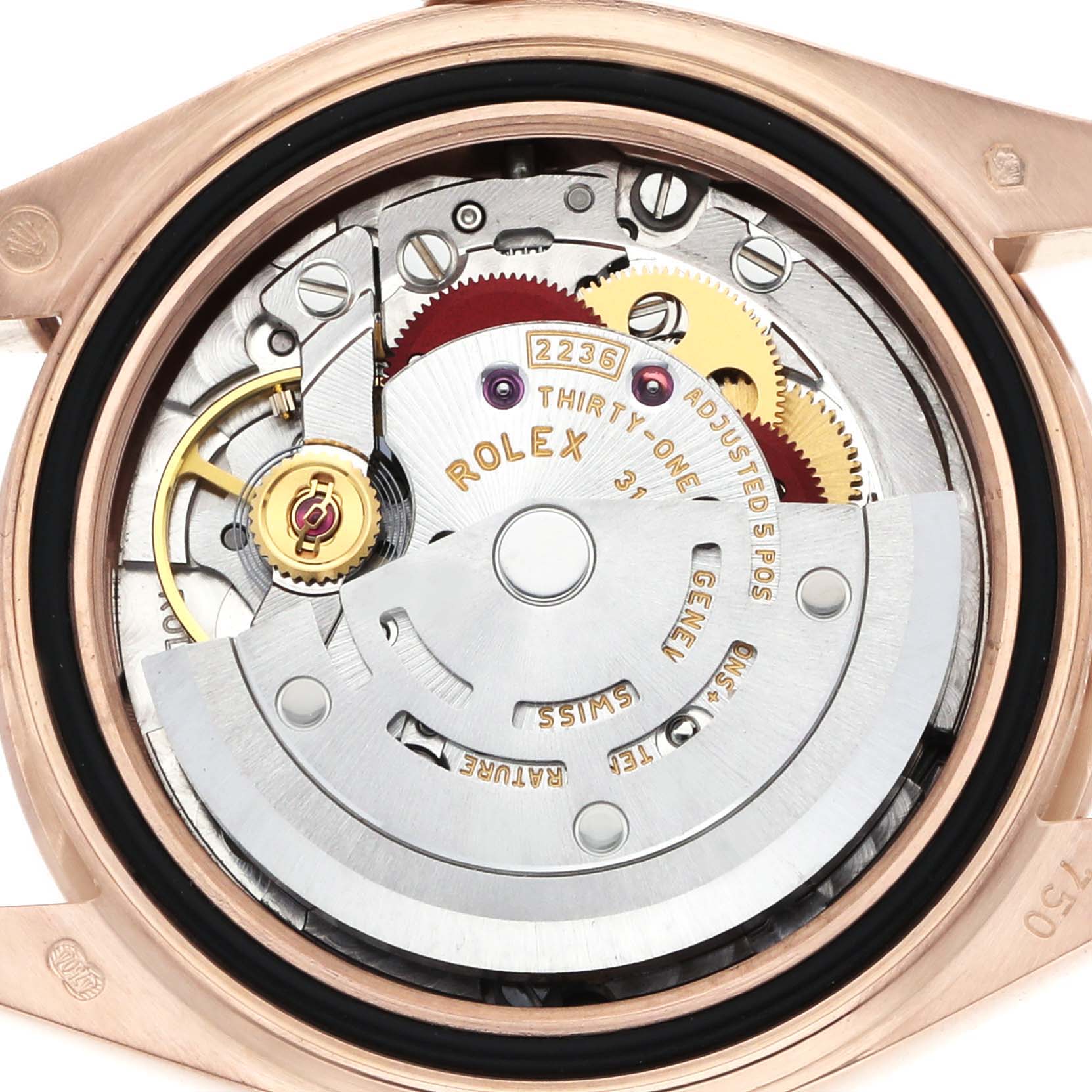The image shows the movement of a Rolex President 279135 Women's Rose Gold Pink Dial model, captured from the back, displaying gears and inscriptions.
