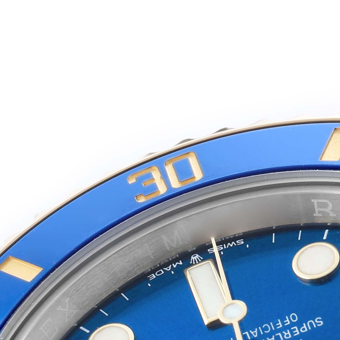 The image shows a close-up of the blue bezel and dial of a Rolex Submariner 126613 Men's Steel and Gold (two tone) Blue Dial, highlighting the "30" marker and part of the minute hand.