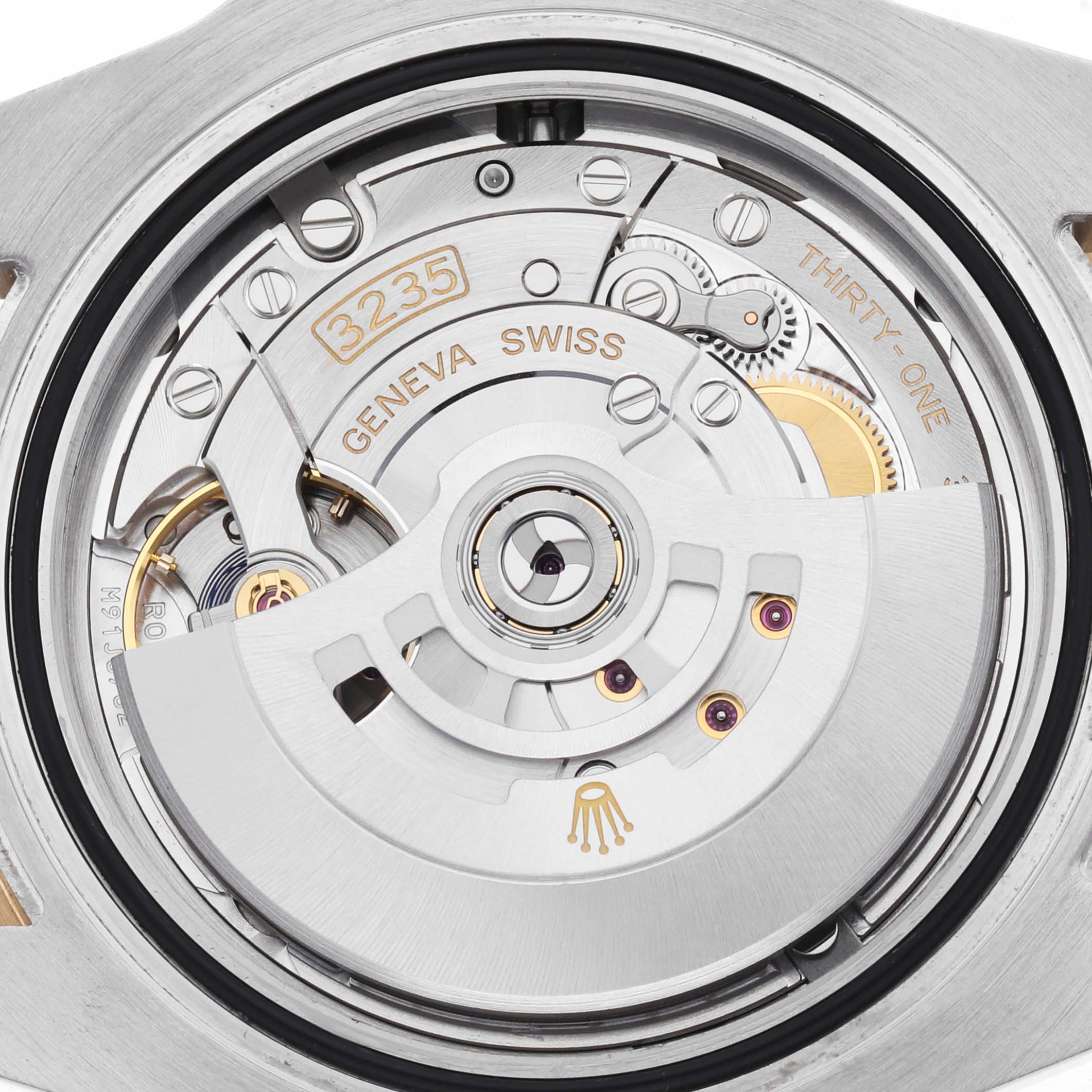 The image shows the Rolex Submariner 126613 Men's Steel and Gold (two tone) Blue Dial's movement, focusing on the intricate mechanics and rotor from a back view angle.