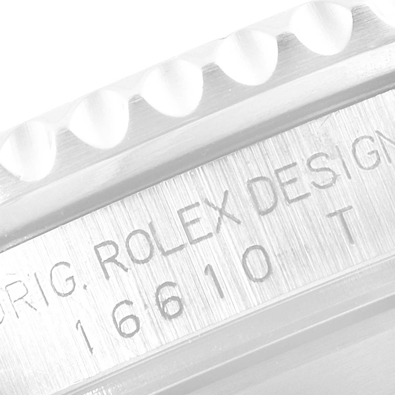 Close-up of the Rolex Submariner 16610 Men's Stainless Steel Black Dial 16610 Men's Stainless Steel Black Dial case side, showing the model number and engraved text.