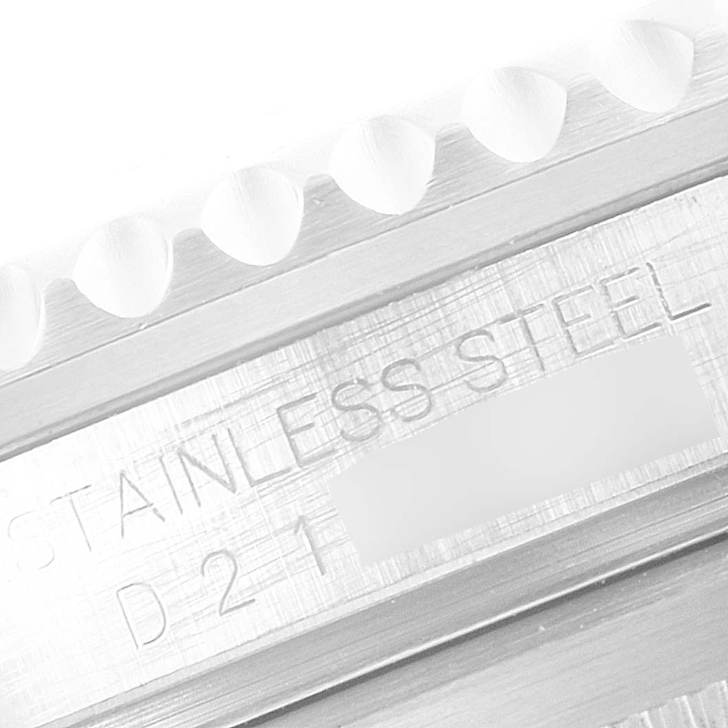 This image shows a close-up angled view of the stainless steel bezel and part of the casing of a Rolex Submariner 16610 Men's Stainless Steel Black Dial 16610 Men's Stainless Steel Black Dial watch.