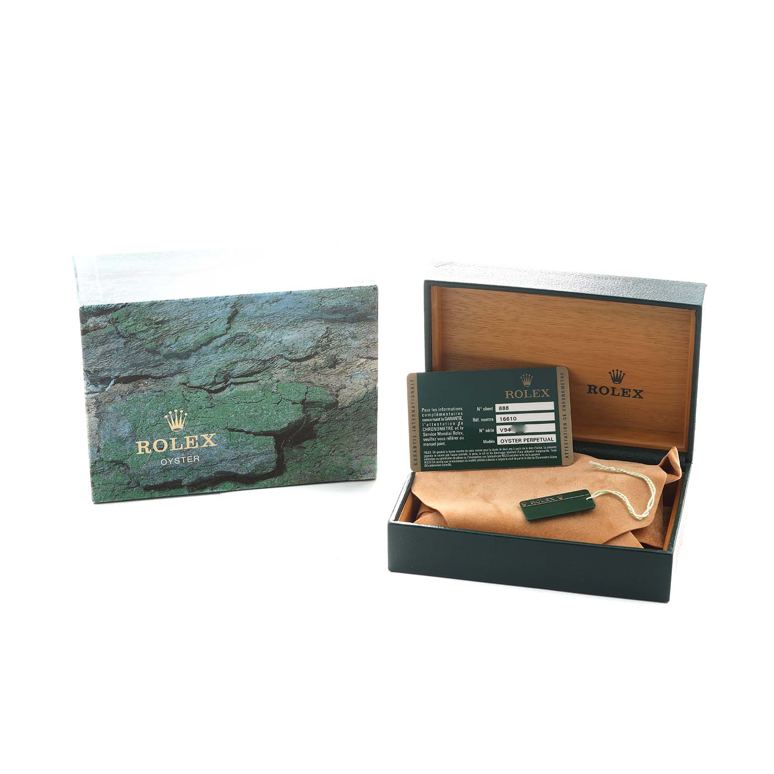 The image shows a Rolex Submariner 16610 Men's Stainless Steel Black Dial box, card, manual, and a pouch from a top angle.