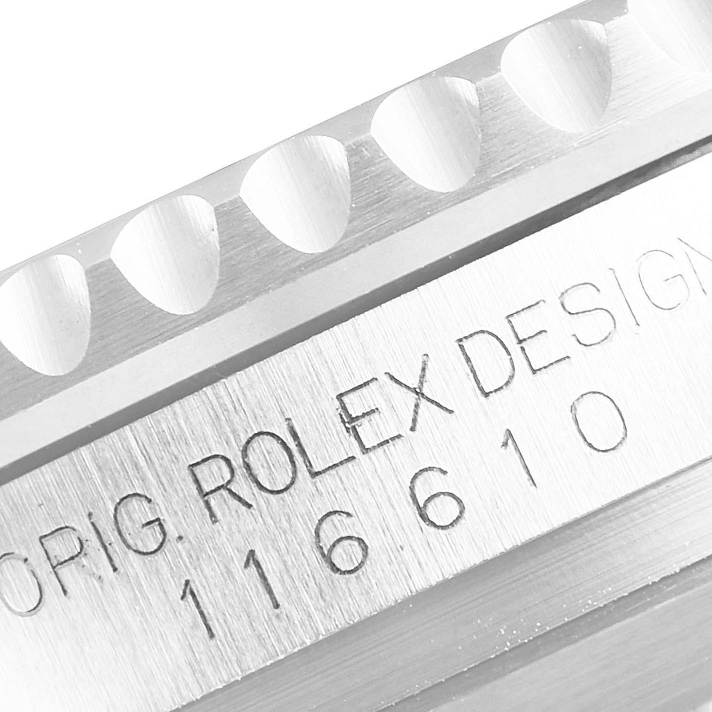 The image shows a close-up angle of the engraved model number and bezel teeth of a Rolex Submariner 116610LV Men's Stainless Steel Green Dial 116610LV Men's Stainless Steel Green Dial watch.