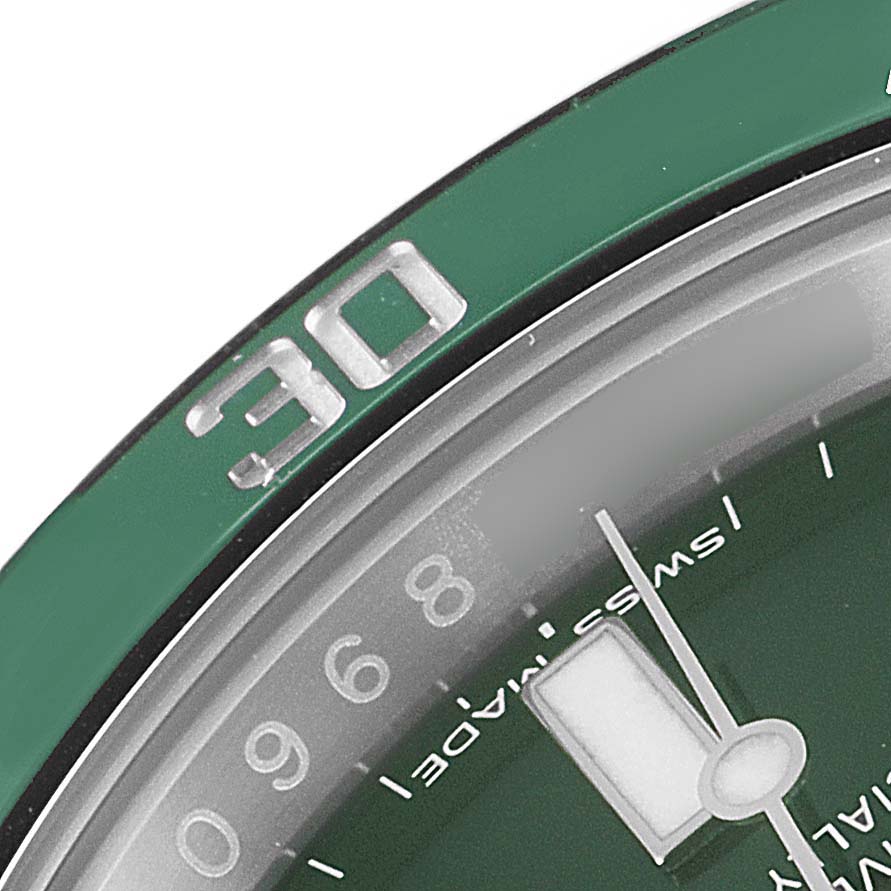 This close-up image of a Rolex Submariner 116610LV Men's Stainless Steel Green Dial 116610LV Men's Stainless Steel Green Dial watch shows part of the green bezel, dial, minute hand, and the "30" marking.
