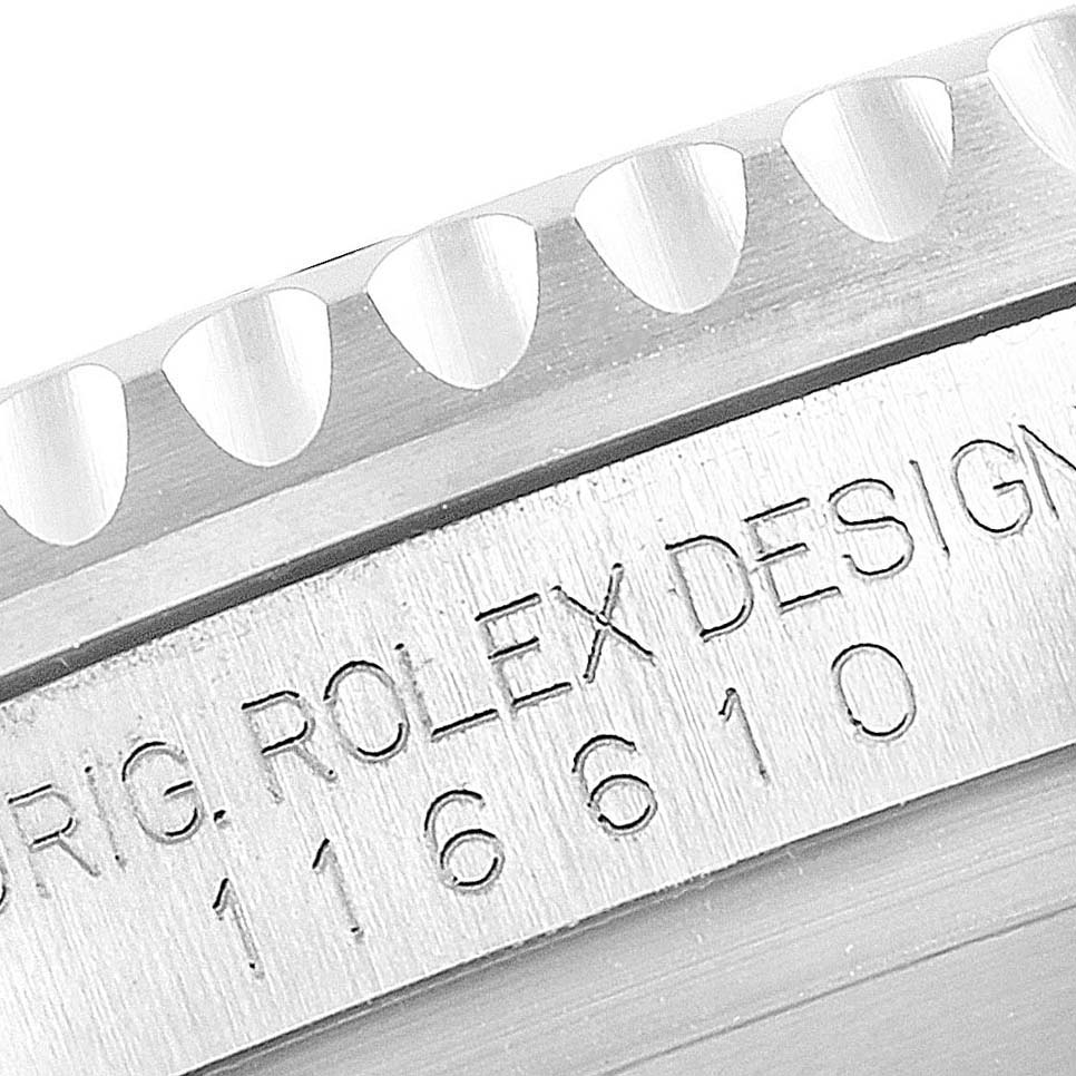 This close-up image shows the side engraving and part of the bezel of a Rolex Submariner 116610LV Men's Stainless Steel Green Dial 116610LV Men's Stainless Steel Green Dial watch.