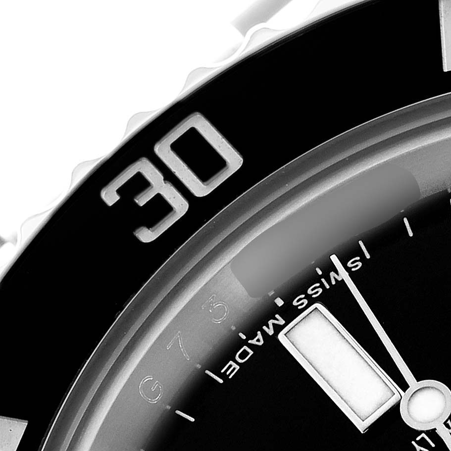 The image shows a close-up of the Rolex Submariner 114060 Men's Stainless Steel Black Dial's bezel and partial dial, highlighting the "30" mark and "Swiss Made" text.
