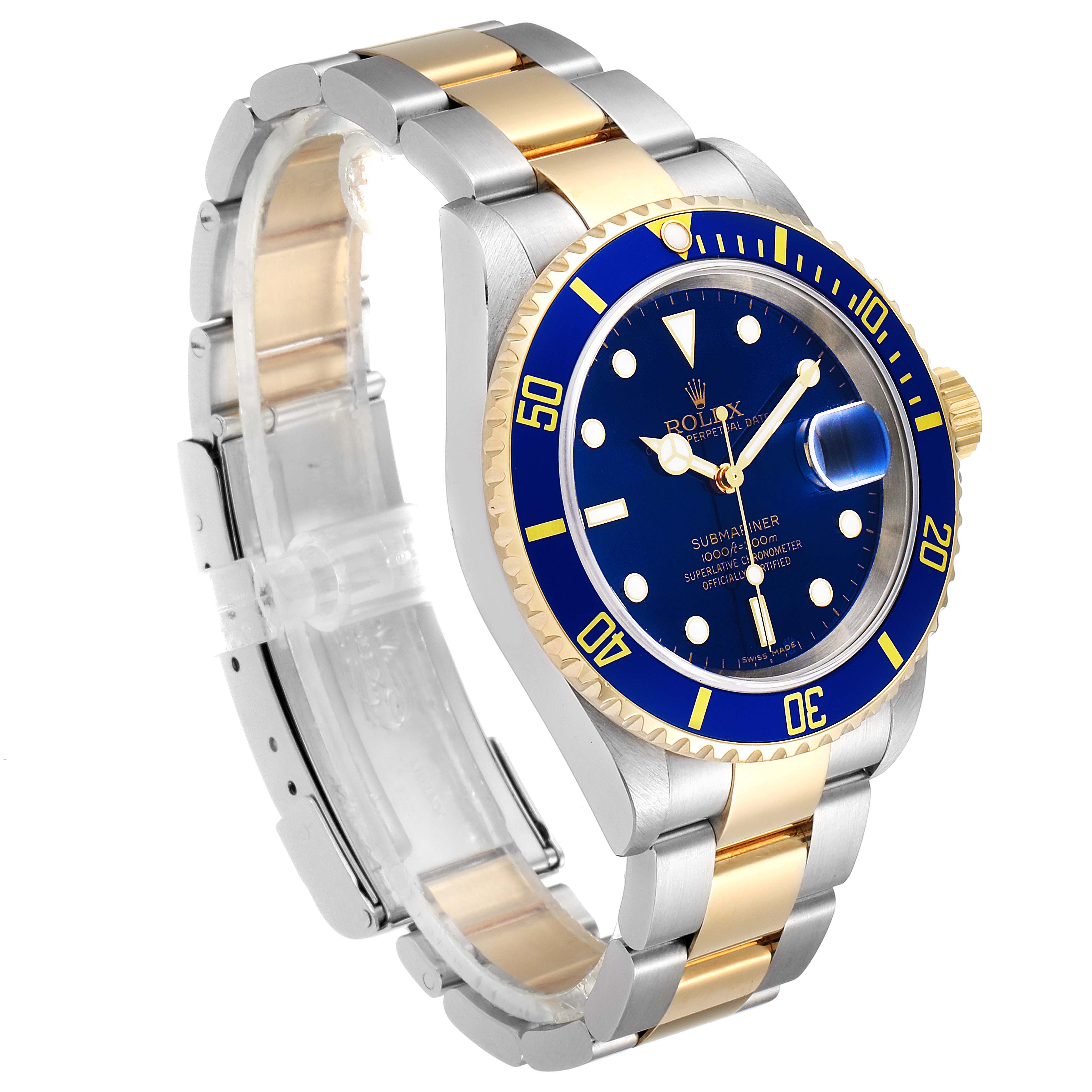 The image shows a Rolex Submariner 16613 Men's Steel and Gold (two tone) Blue Dial 16613 Men's Steel and Gold (two tone) Blue Dial watch at a three-quarter angle, highlighting its blue dial, bezel, and two-tone bracelet.