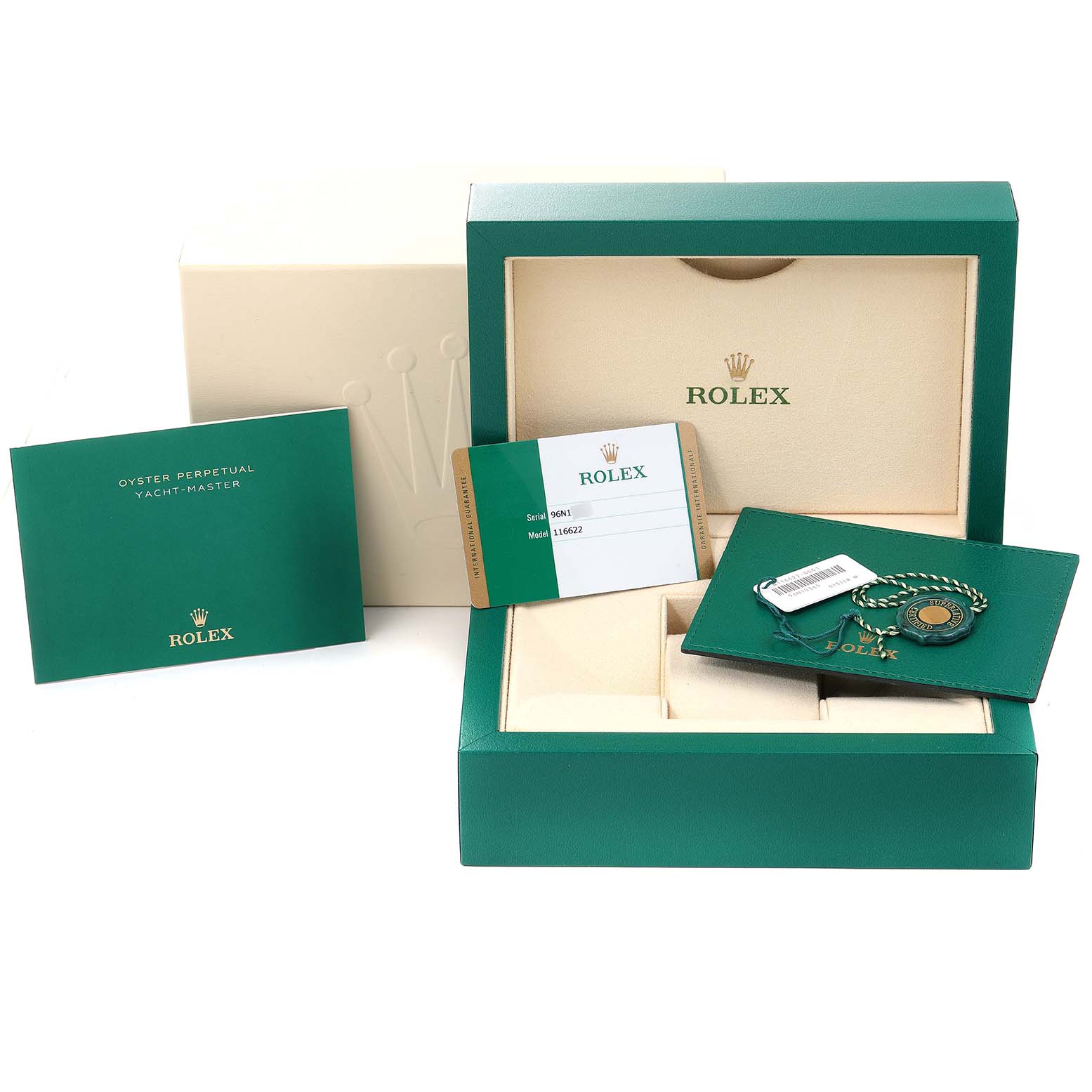 The image shows the packaging, warranty card, booklet, and accessories for the Rolex Yacht-Master 116622 Men
s Stainless Steel Blue Dial 116622 Men
s Stainless Steel Blue Dial watch.