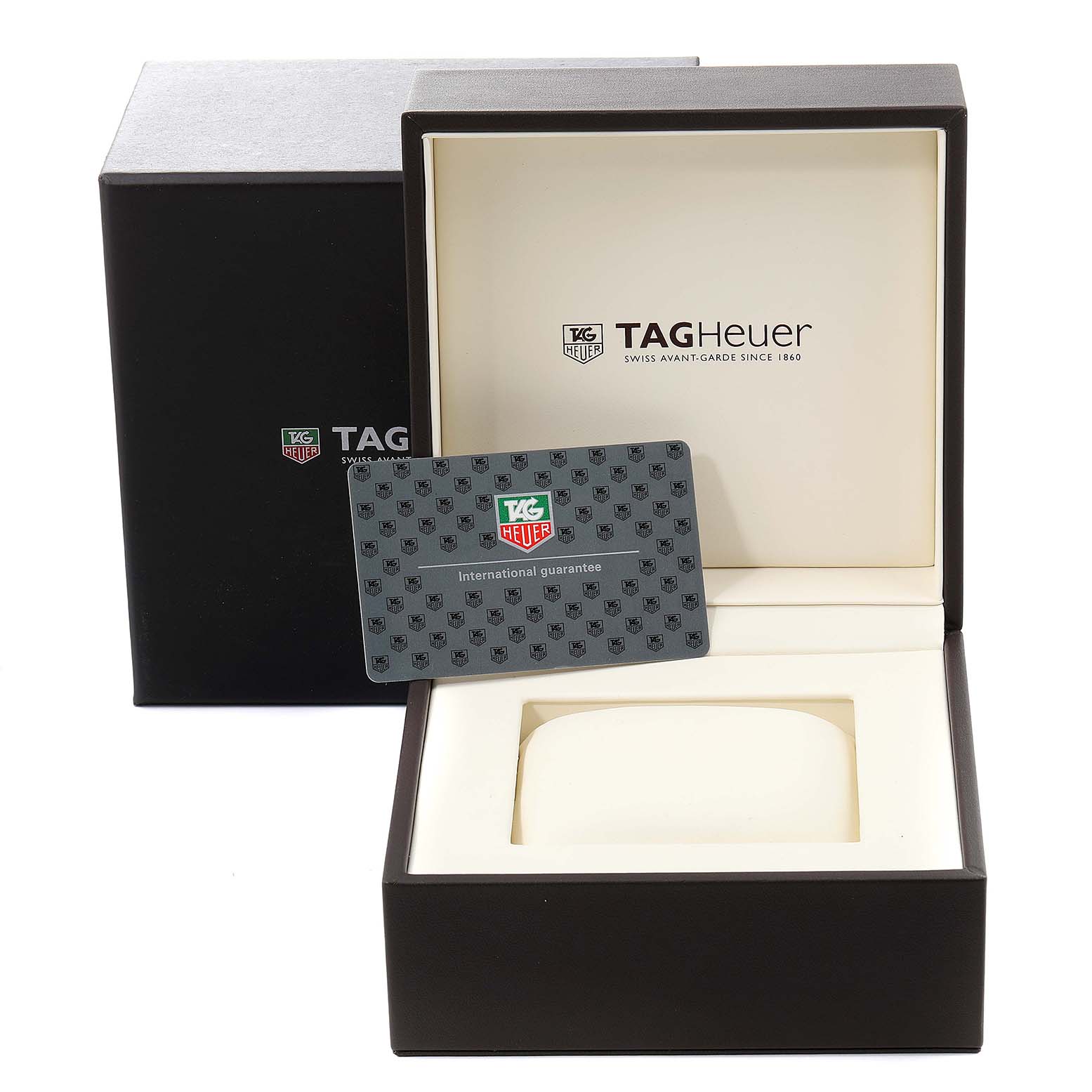 The image shows the packaging and guarantee card for the Monza model by Tag Heuer, with an open box and a card positioned in front.