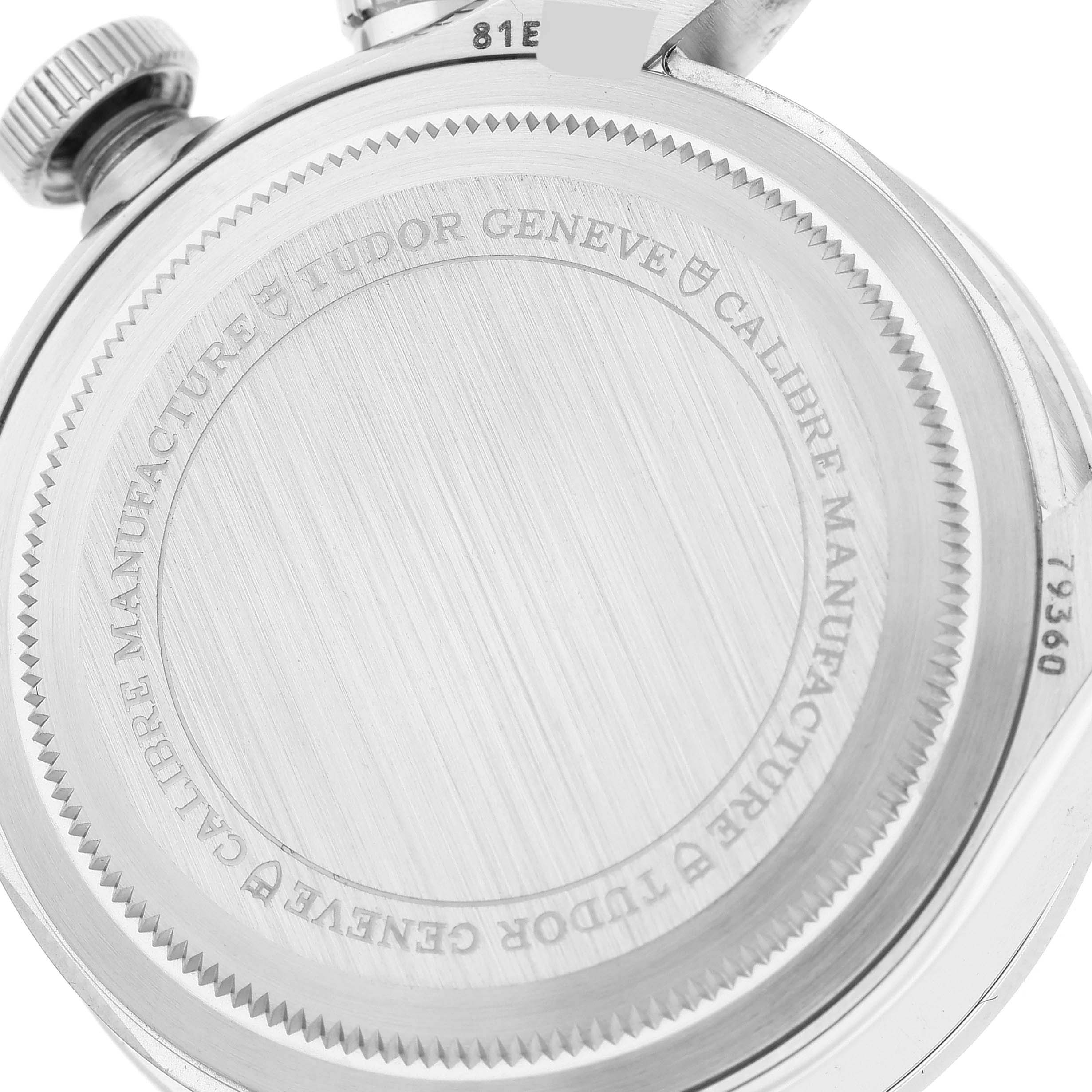 The image shows the back case of a Tudor Heritage Black Bay M79360N-0002 Men's Stainless Steel White Dial M79360N-0002 Men's Stainless Steel White Dial watch, highlighting the engravings and crown.