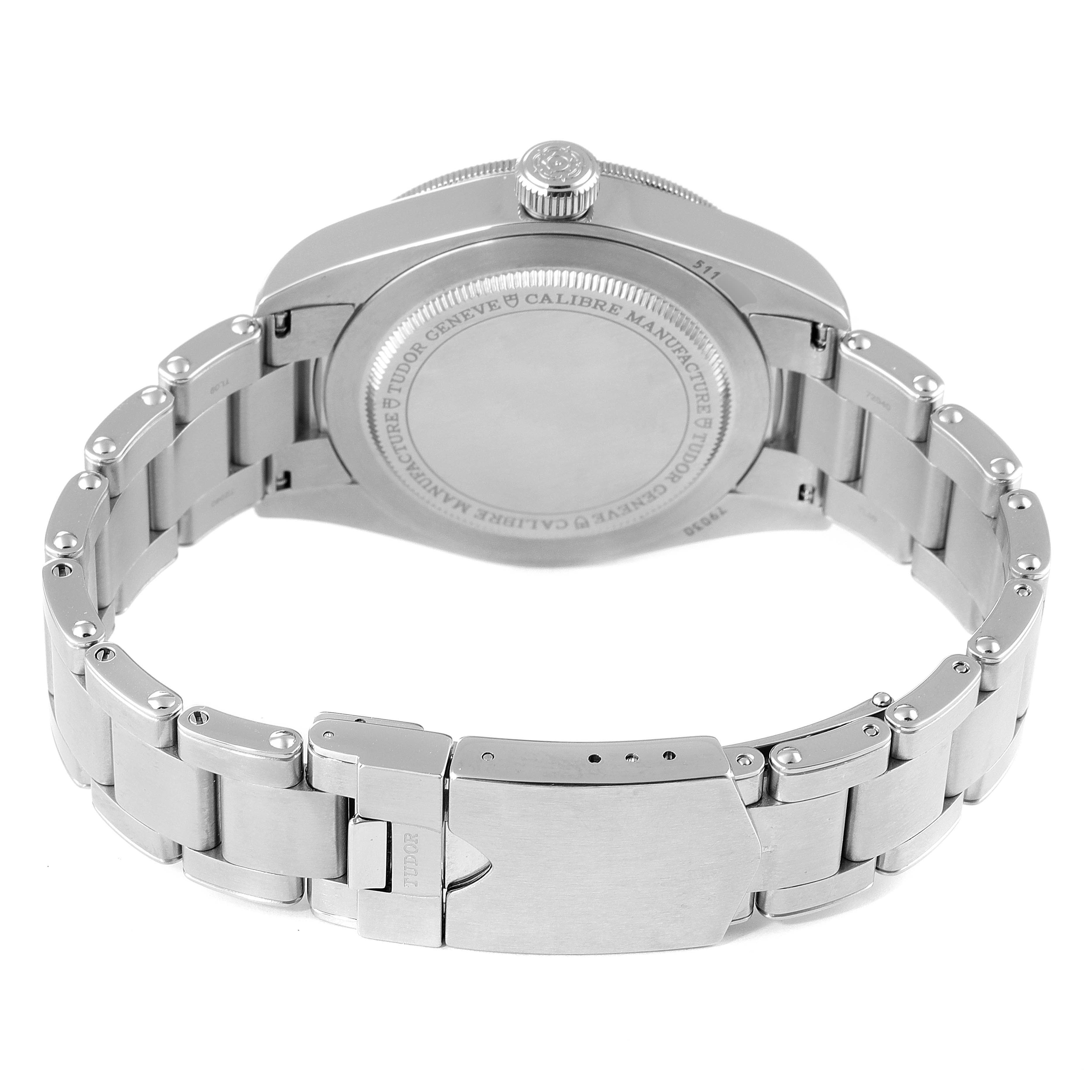 The image shows the backside of a Tudor Heritage Black Bay 79030B Men's Stainless Steel Blue Dial 79030B Men's Stainless Steel Blue Dial watch, highlighting its caseback and metal bracelet.