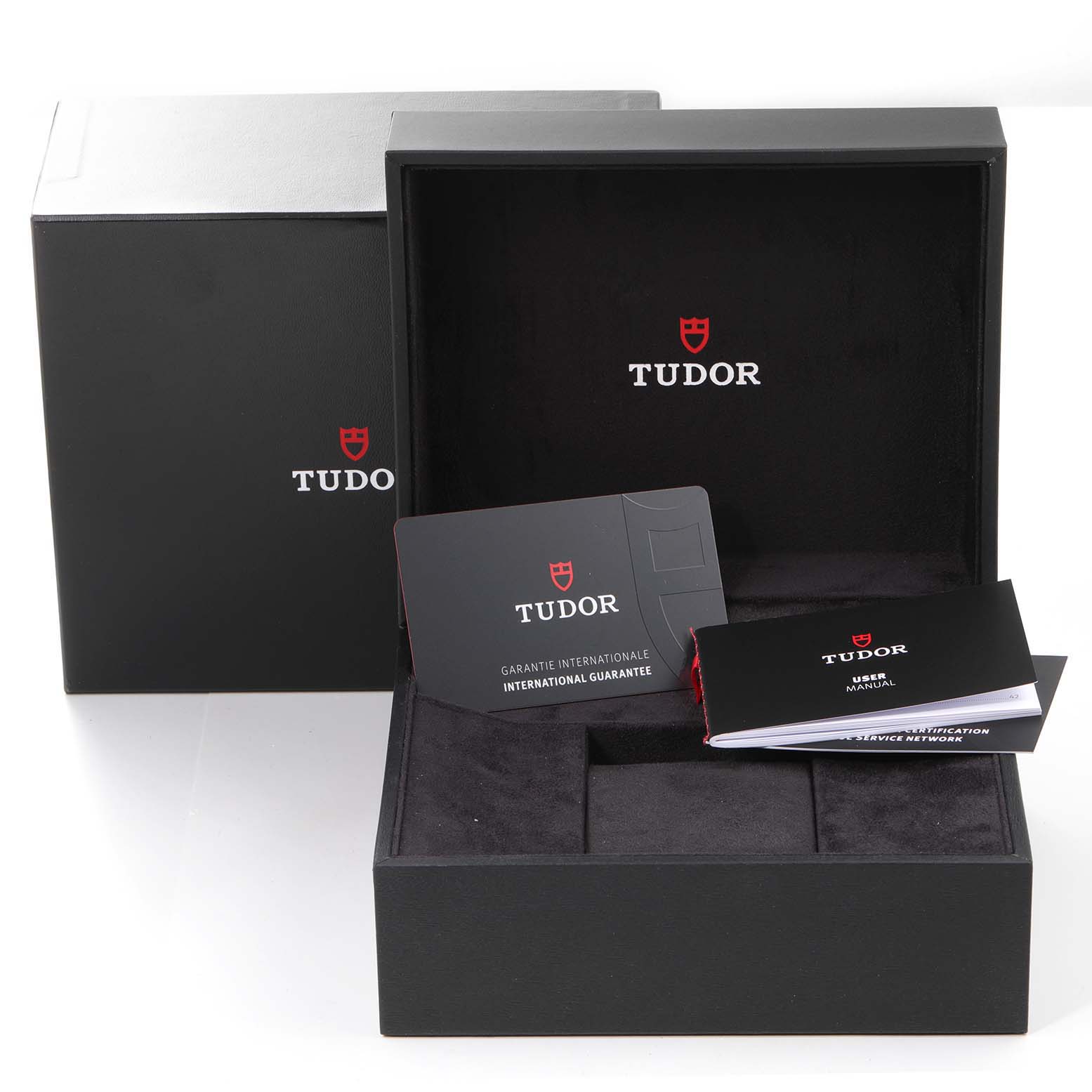 The image shows the open box, international guarantee card, and user manual of the Tudor Heritage Black Bay 79030B Men's Stainless Steel Blue Dial 79030B Men's Stainless Steel Blue Dial watch.
