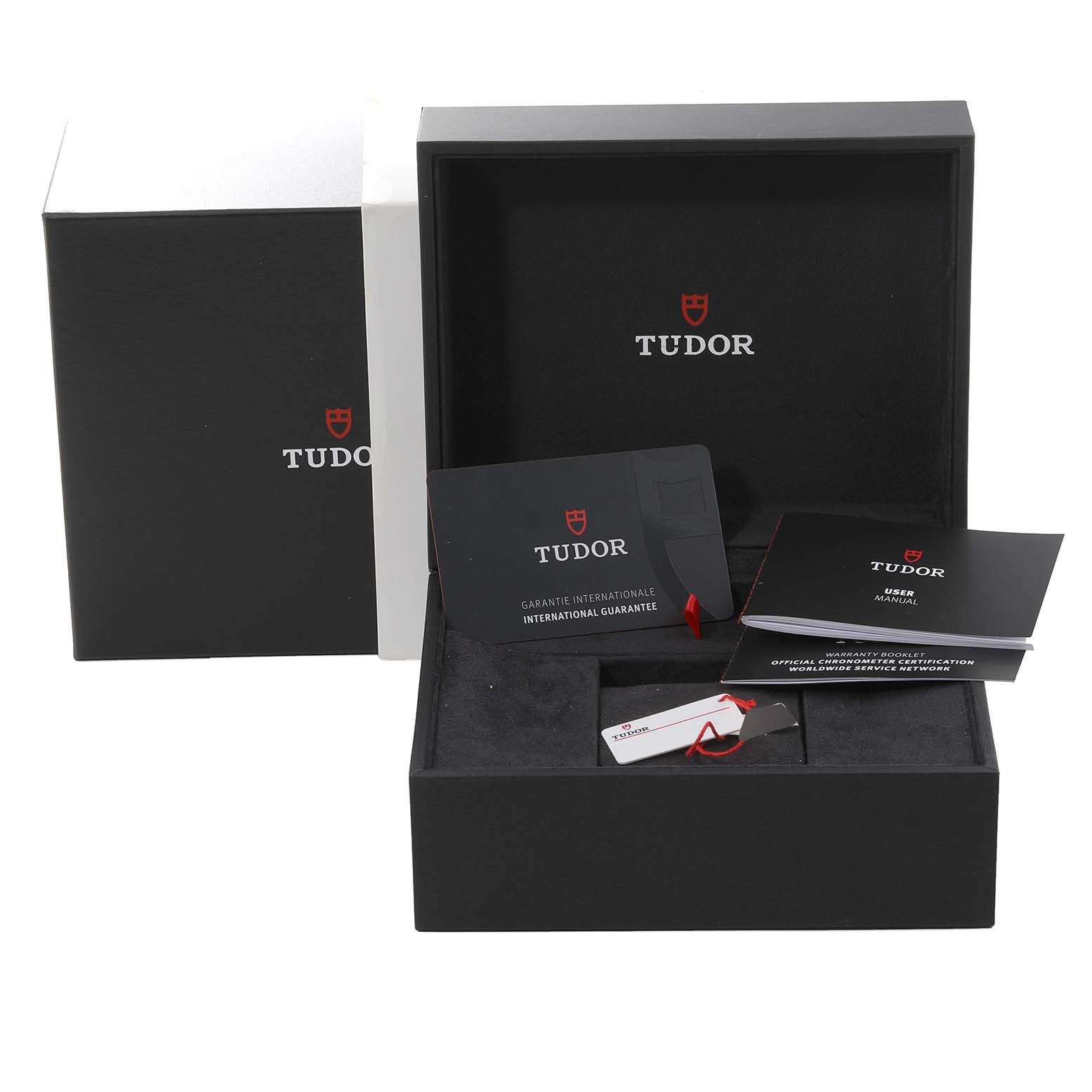 The image shows the packaging, warranty card, tags, and manual of a Tudor Heritage Black Bay 79250BA Men's Bronze Black Dial 79250BA Men's Bronze Black Dial watch.