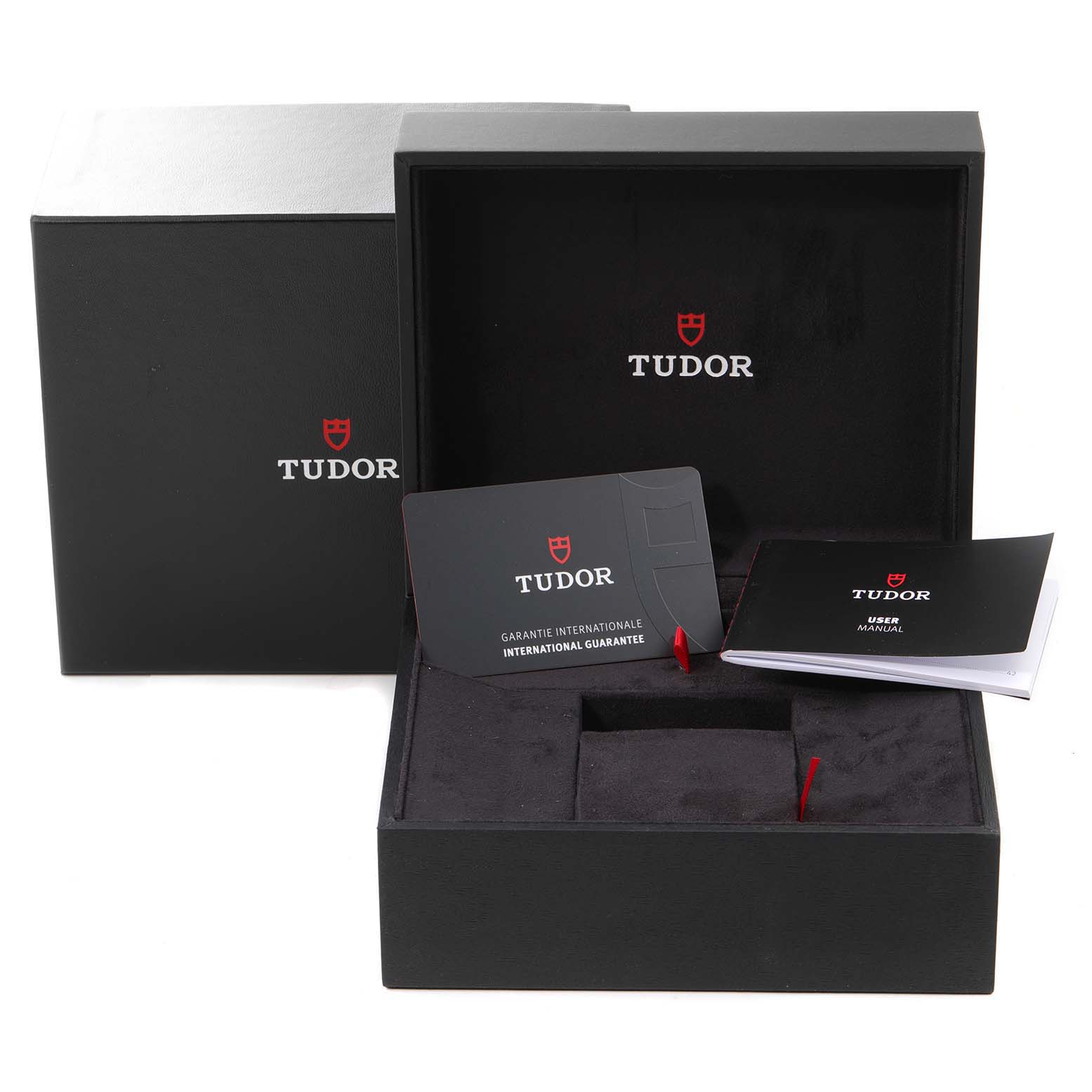 The image shows the packaging, international guarantee card, and user manual for a Tudor Heritage Black Bay 79360N Men's Stainless Steel Black Dial 79360N Men's Stainless Steel Black Dial watch.