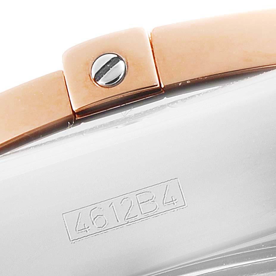 The image shows a close-up of the Breitling Chronomat CB0420 Men's Steel and Gold (two tone) Silver Dial CB0420 Men's Steel and Gold (two tone) Silver Dial watch's side, including part of the bracelet and a visible screw.