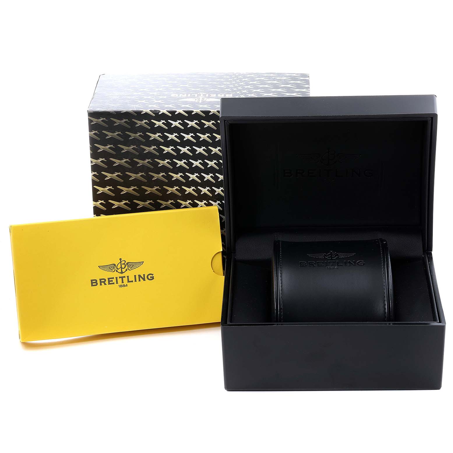 This image shows the packaging and accessories of a Breitling Chronomat CB0420 Men's Steel and Gold (two tone) Silver Dial CB0420 Men's Steel and Gold (two tone) Silver Dial watch, including a branded box, a yellow booklet, and a watch case.