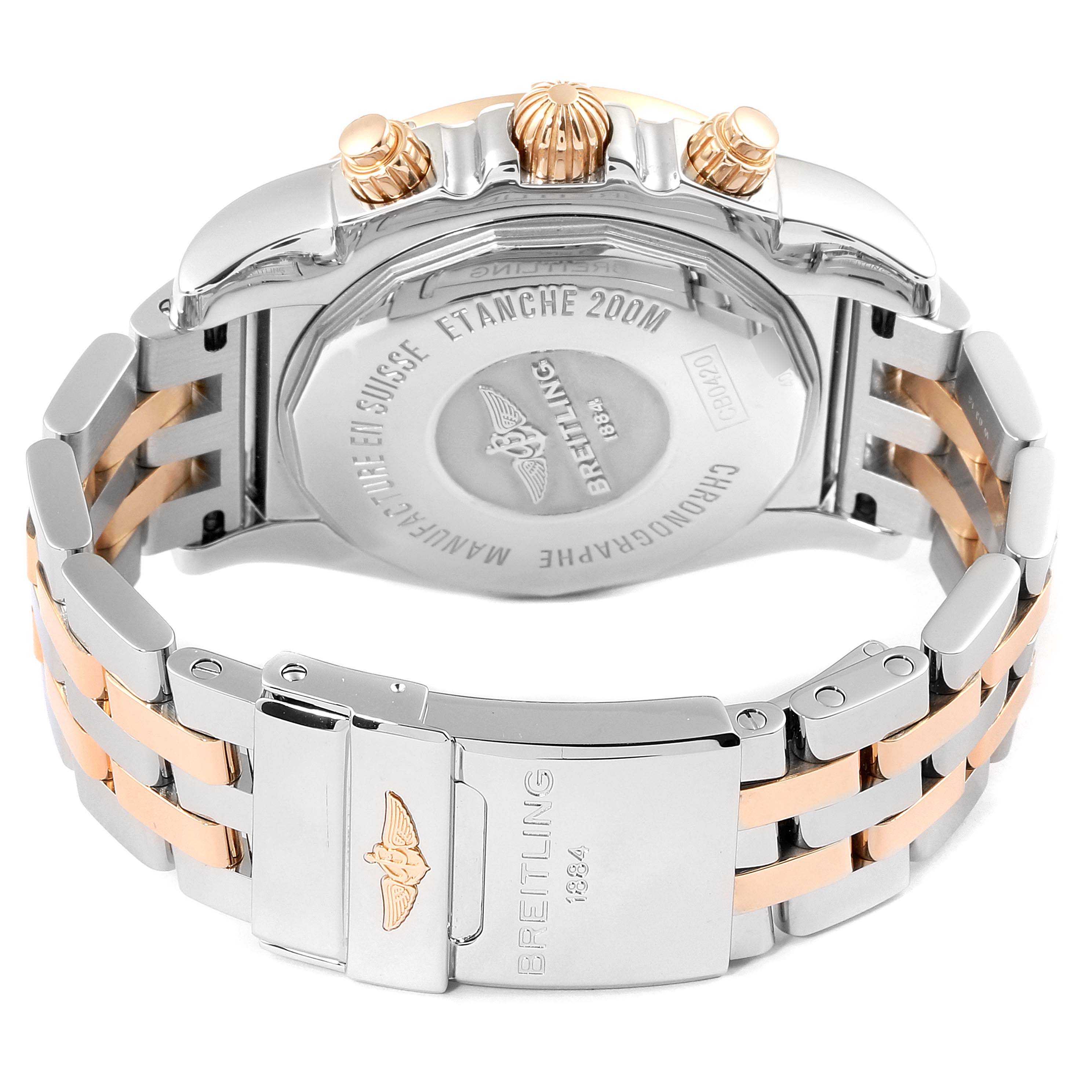 The image shows the back of the Breitling Chronomat CB0420 Men's Steel and Gold (two tone) Silver Dial CB0420 Men's Steel and Gold (two tone) Silver Dial watch, highlighting the clasp, metal bracelet, and case back.