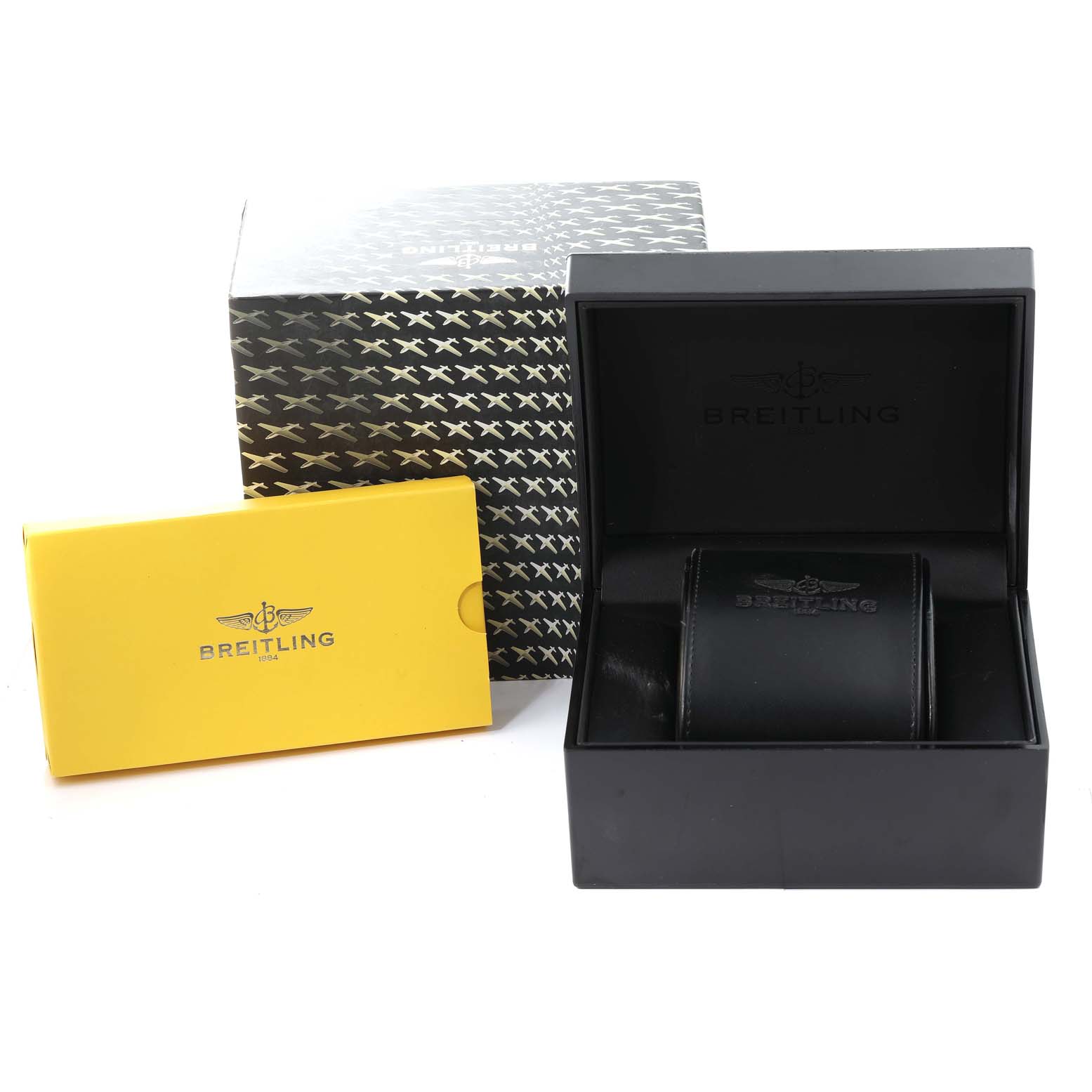 The image shows the packaging accessories for the Breitling Colt A73380 Men's Stainless Steel White Dial A73380 Men's Stainless Steel White Dial watch, including the outer box, display box, and a yellow booklet.