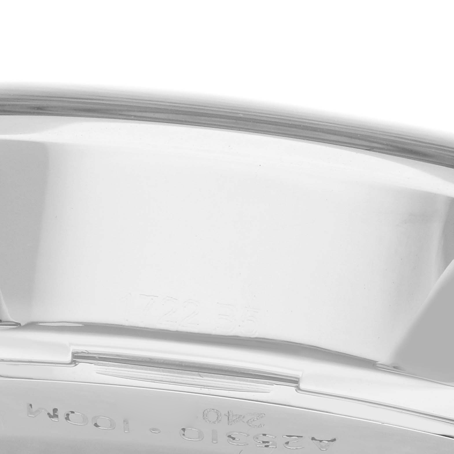 The image shows a close-up of the side case and part of the back of a Breitling Premier A25310 Men's Stainless Steel Red Dial watch with engraved markings.