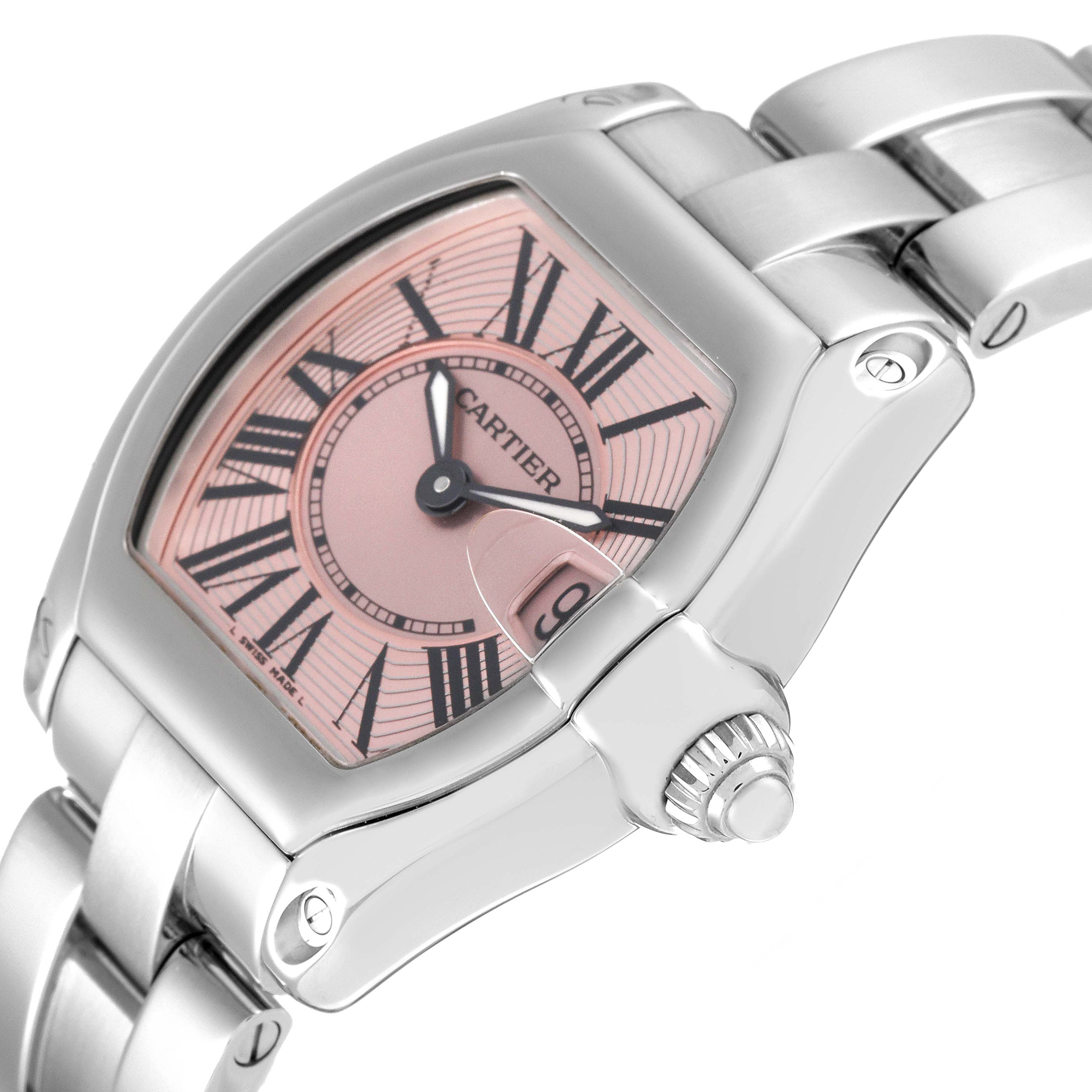 This image shows a close-up angle of a Cartier Roadster W62017V3 Women's Stainless Steel Pink Dial W62017V3 Women's Stainless Steel Pink Dial watch, highlighting the pink dial, Roman numerals, and stainless steel bracelet.