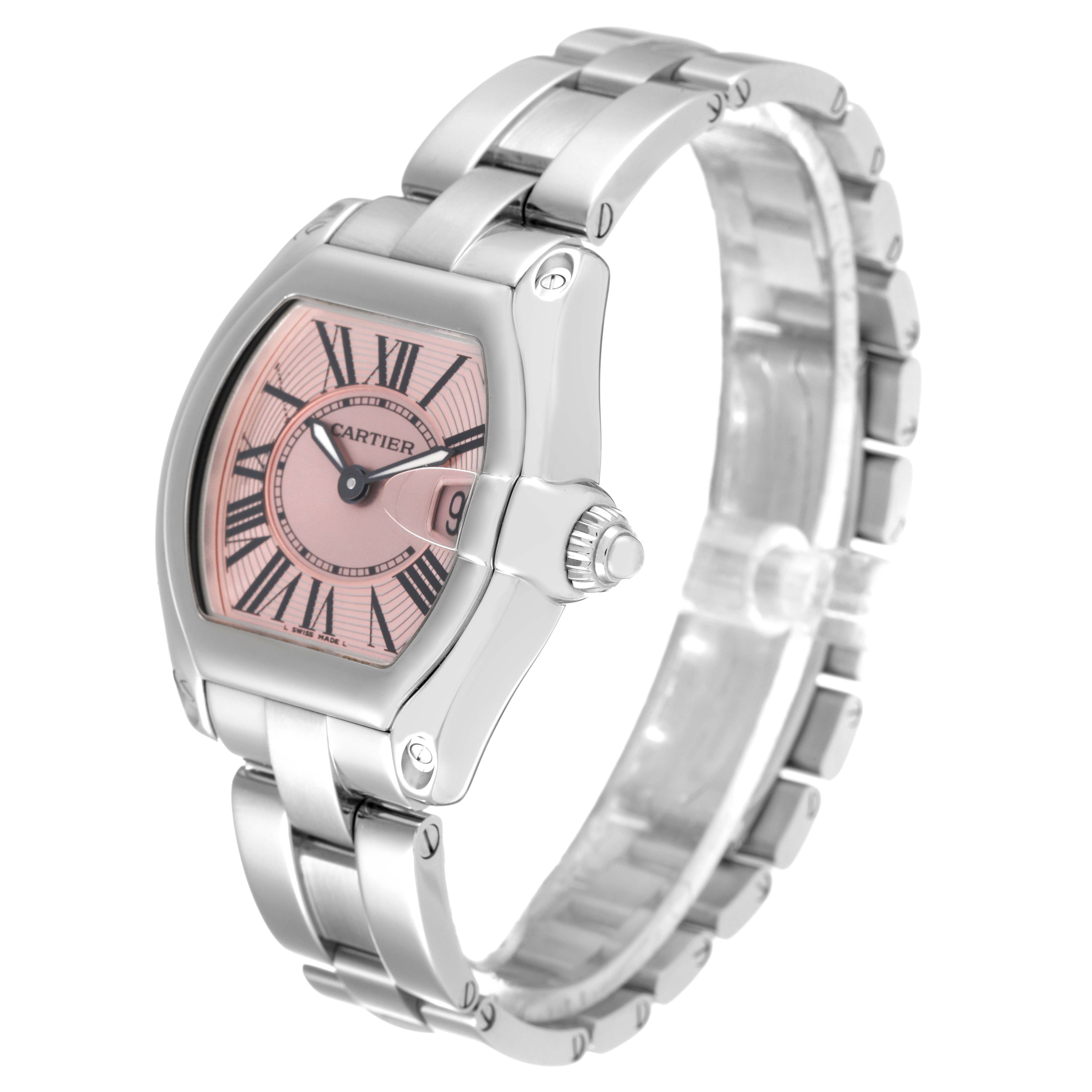 The image shows a Cartier Roadster W62017V3 Women's Stainless Steel Pink Dial W62017V3 Women's Stainless Steel Pink Dial watch from an oblique angle, highlighting the face, crown, and parts of the bracelet.