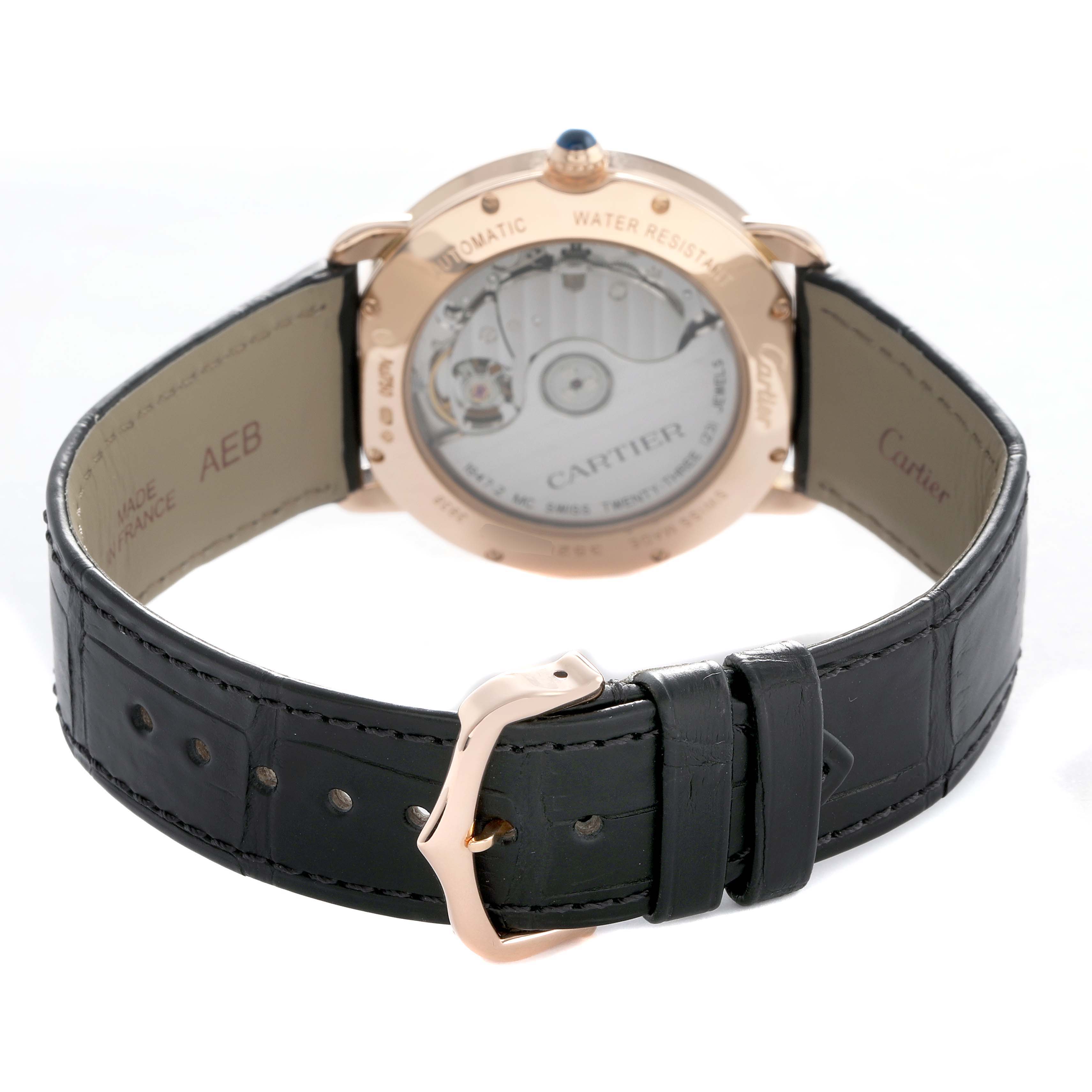 The image shows the back view of the Cartier Ronde WGRN0006 Men's Rose Gold Silver Dial watch, highlighting its automatic movement and leather strap.